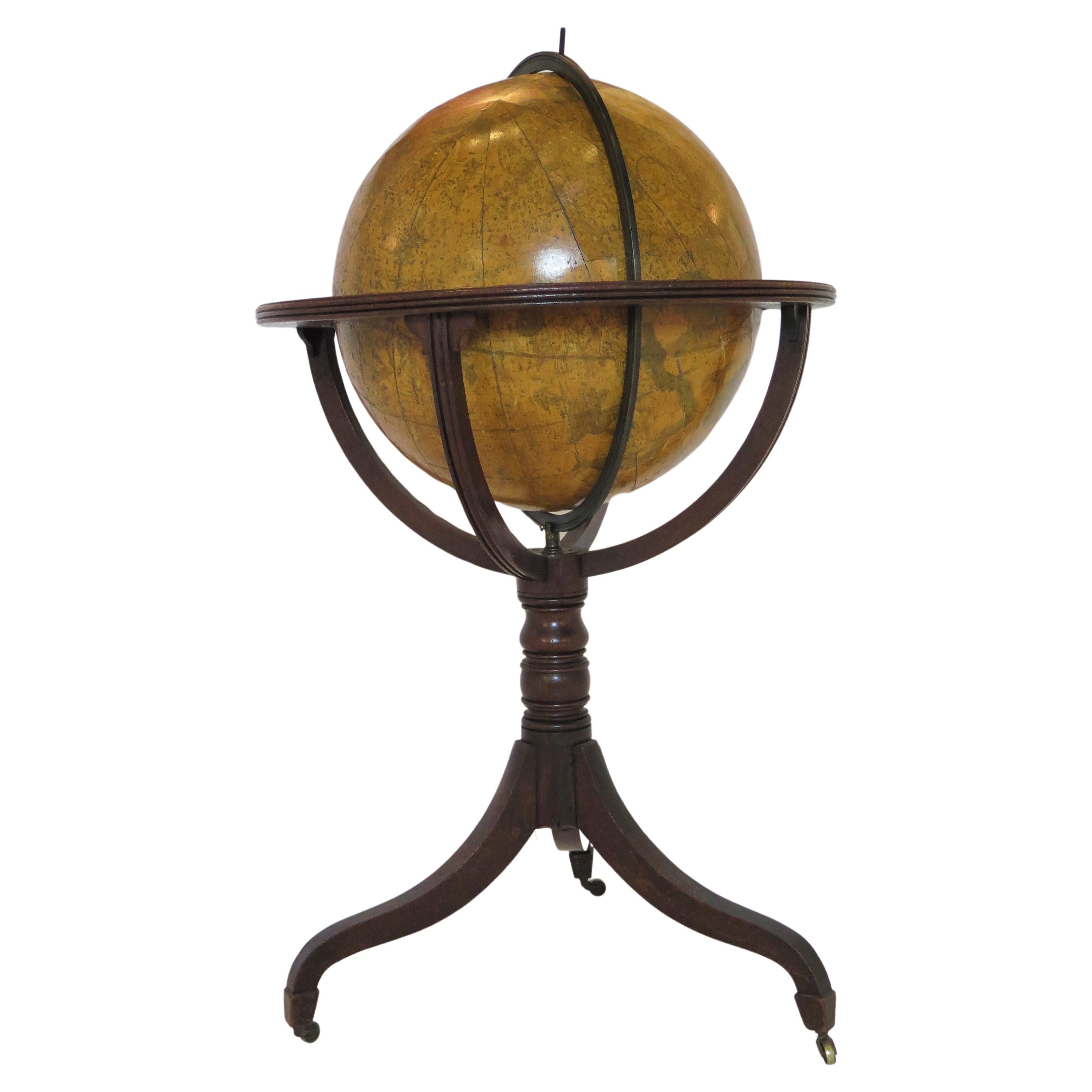 A George III eighteen inch celestial globe by W. and T.M. Bardin, dated 1800, in a mahogany tripod floor stand having graceful curved legs with brass caps and castors. the cartouche reads: to the  Rev. Nevil Maskelyne, D.D., F.R.S. Astronomer Royal,