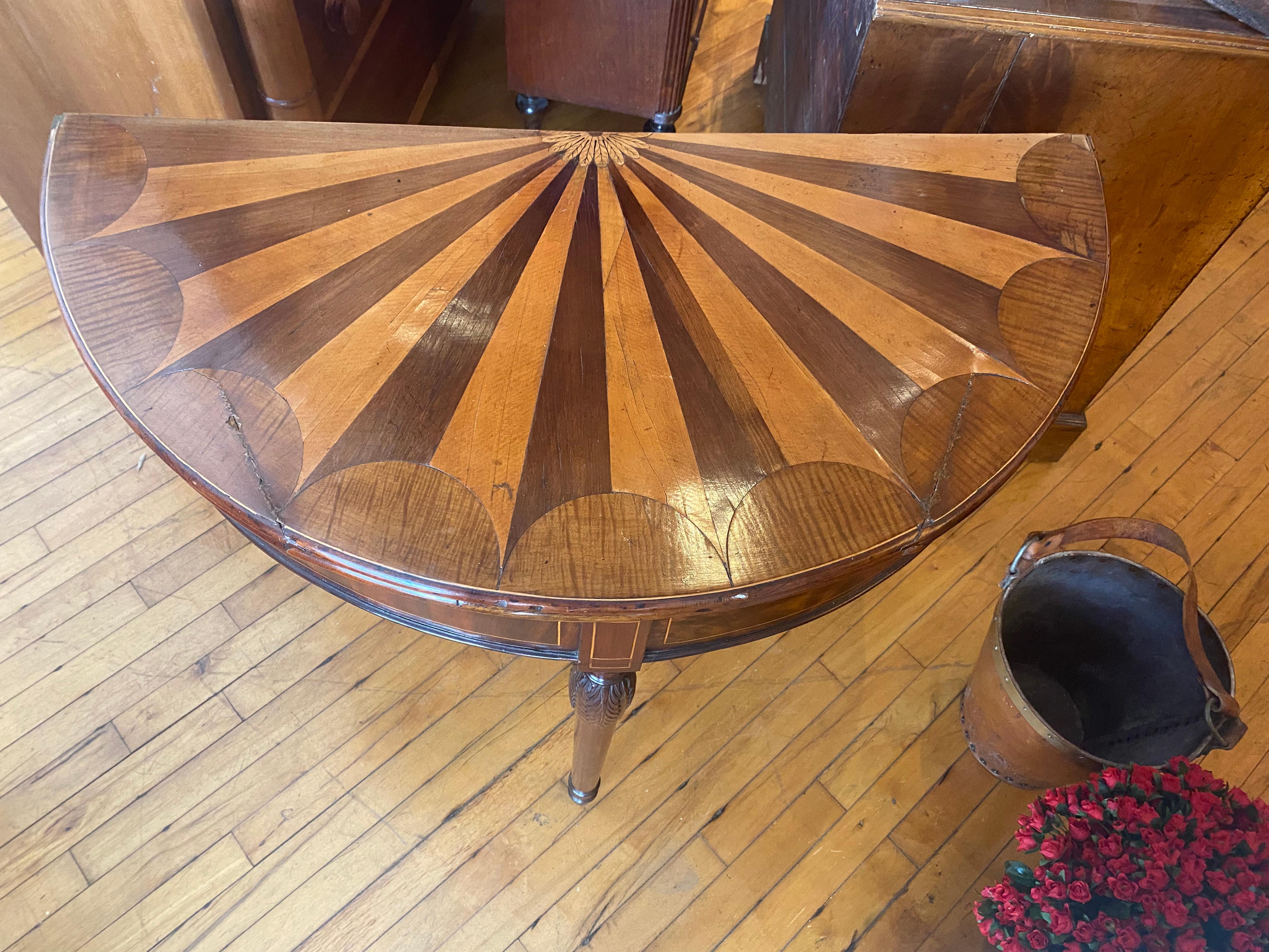 A George III fan shaped, specimen wood, inlaid demilune flip top card table. In Excellent Condition For Sale In Buchanan, MI