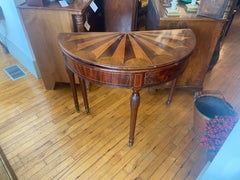A George III fan shaped, specimen wood, inlaid demilune flip top card table.