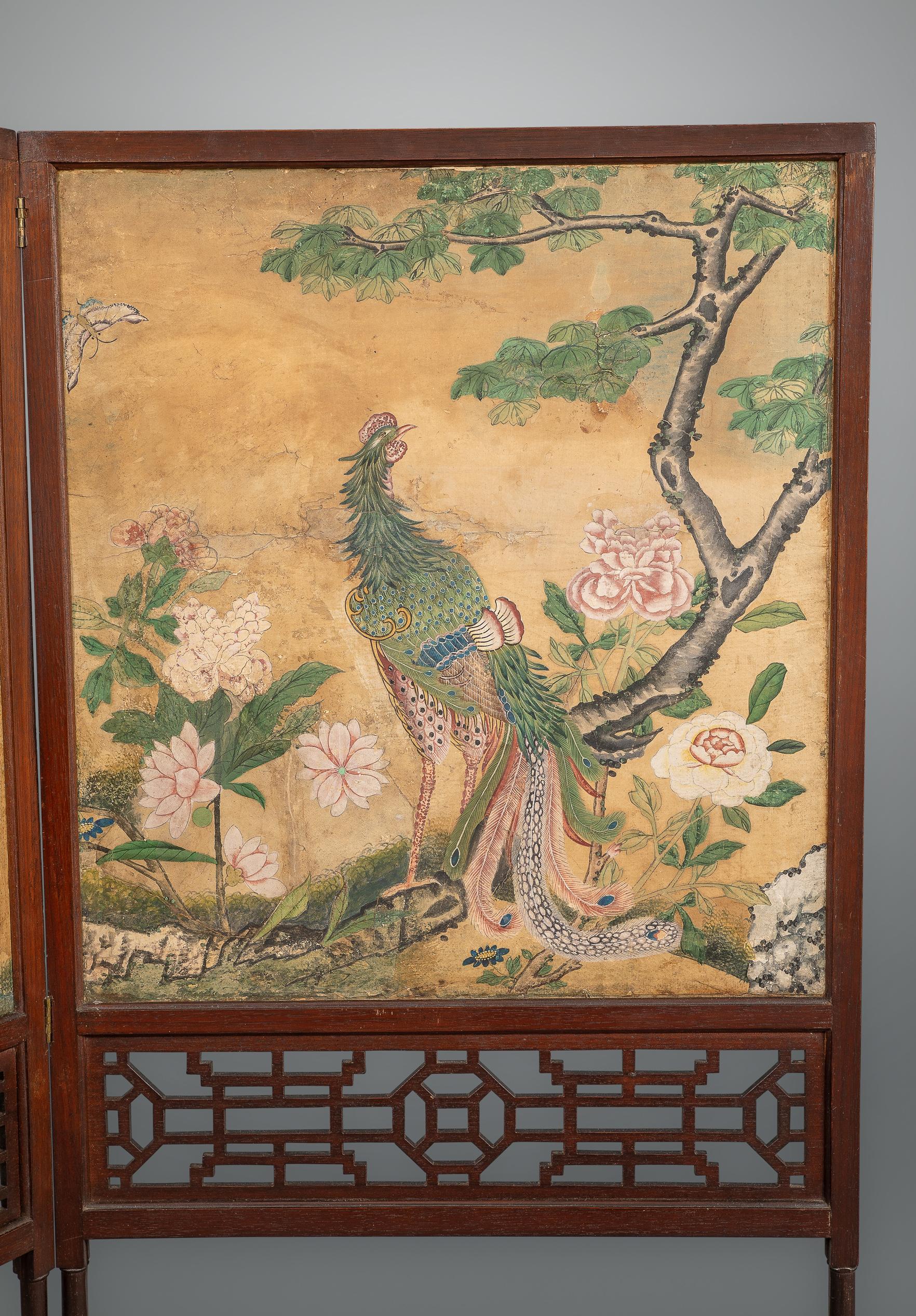 Probably by Chippendale and certainly from his workshop this screen is from a well known group executed, circa 1765.
The folding screen enclosing hand painted Chinese wall paper above bands of Chinese Chippendale fret work leading to delicate legs