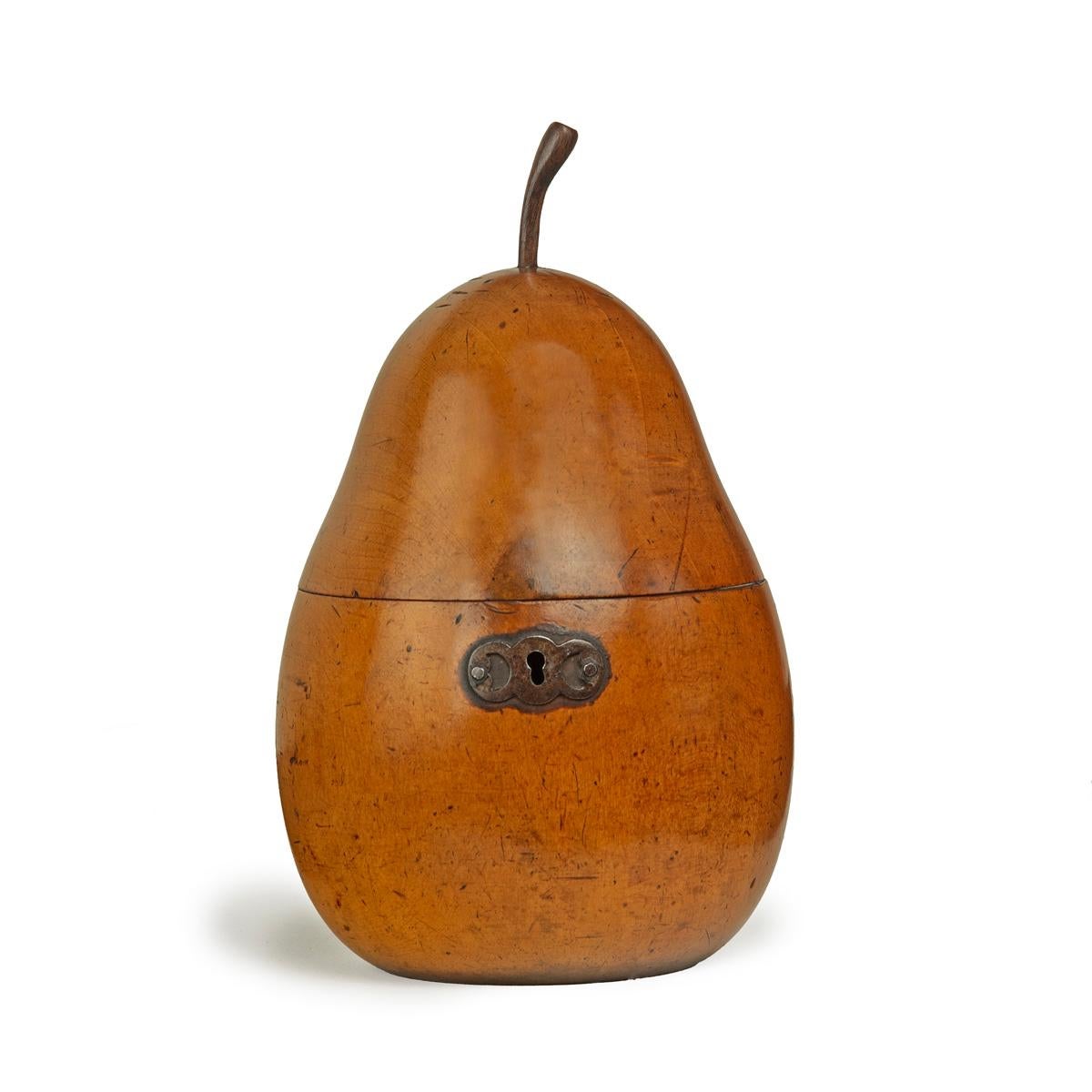 A George III fruitwood pear tea caddy, English, circa 1800.
