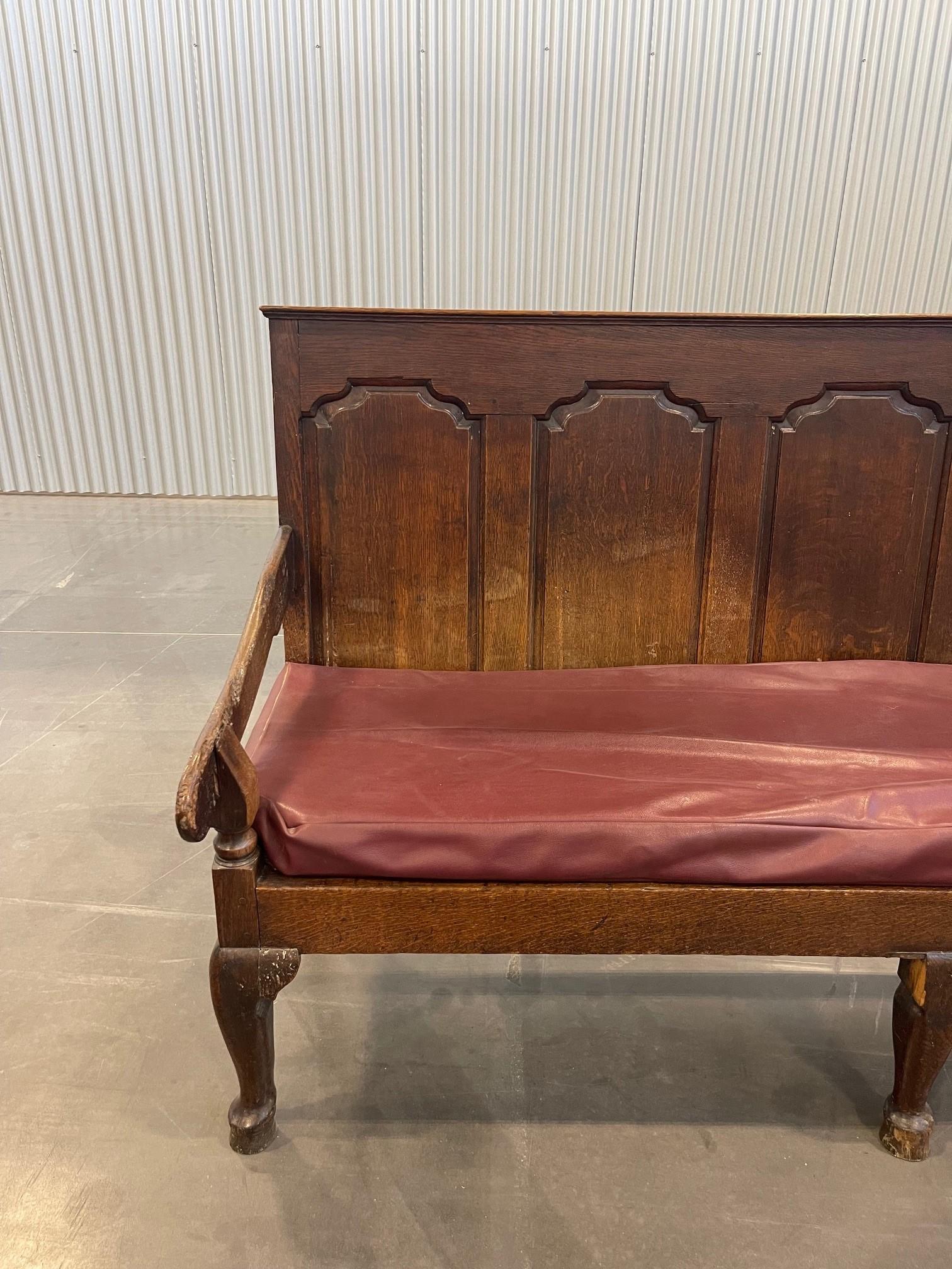 A George III (1790) Lancastrian oak panel back settle, raised on cabriole legs. 
Wonderful settle from the Stone House needs a little TLC, but otherwise a generally solid piece of furniture. The left arm connection between upright and arm is a