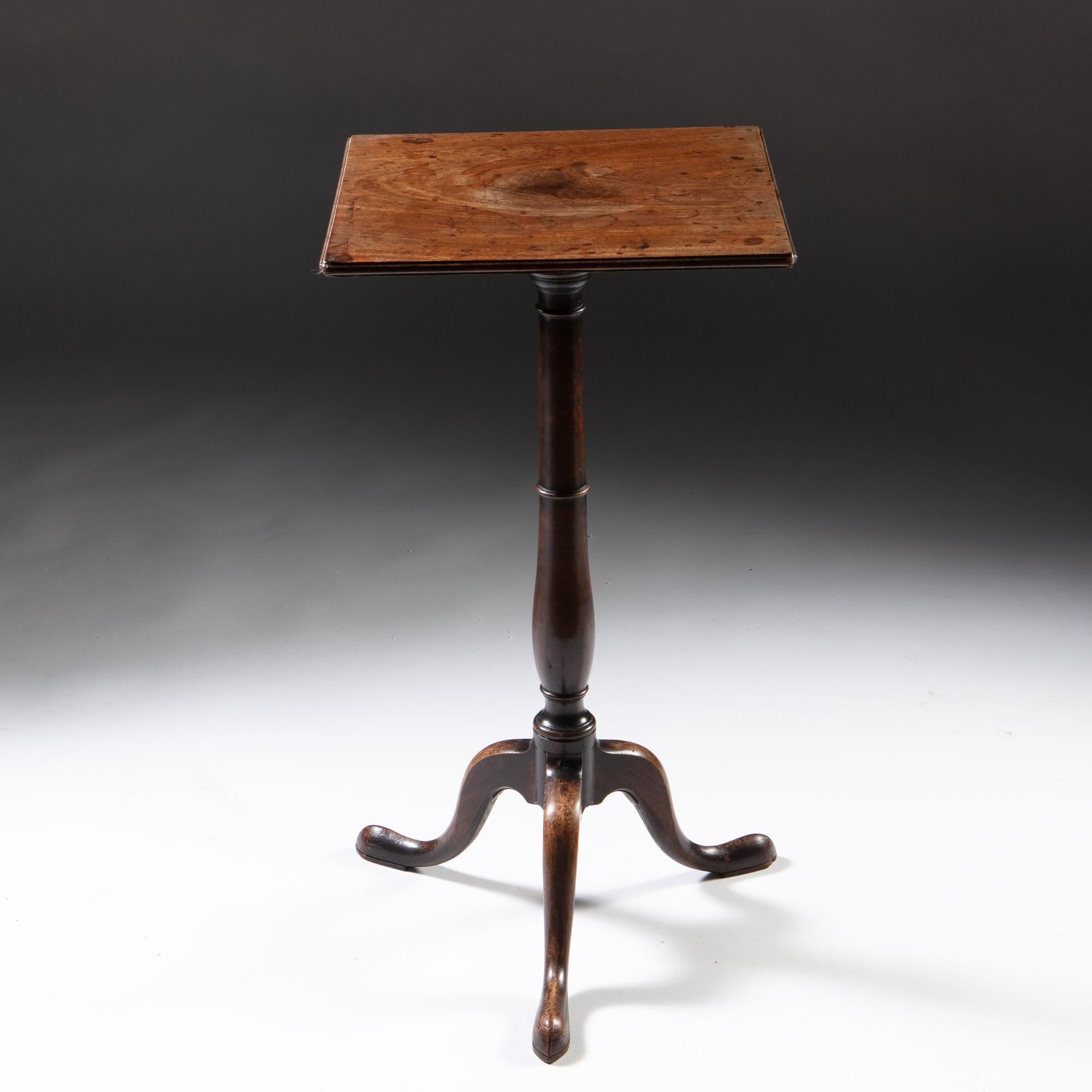 A charming George III period mahogany occasional table with sun bleached top, supported on a baluster stem terminating in three splayed legs.