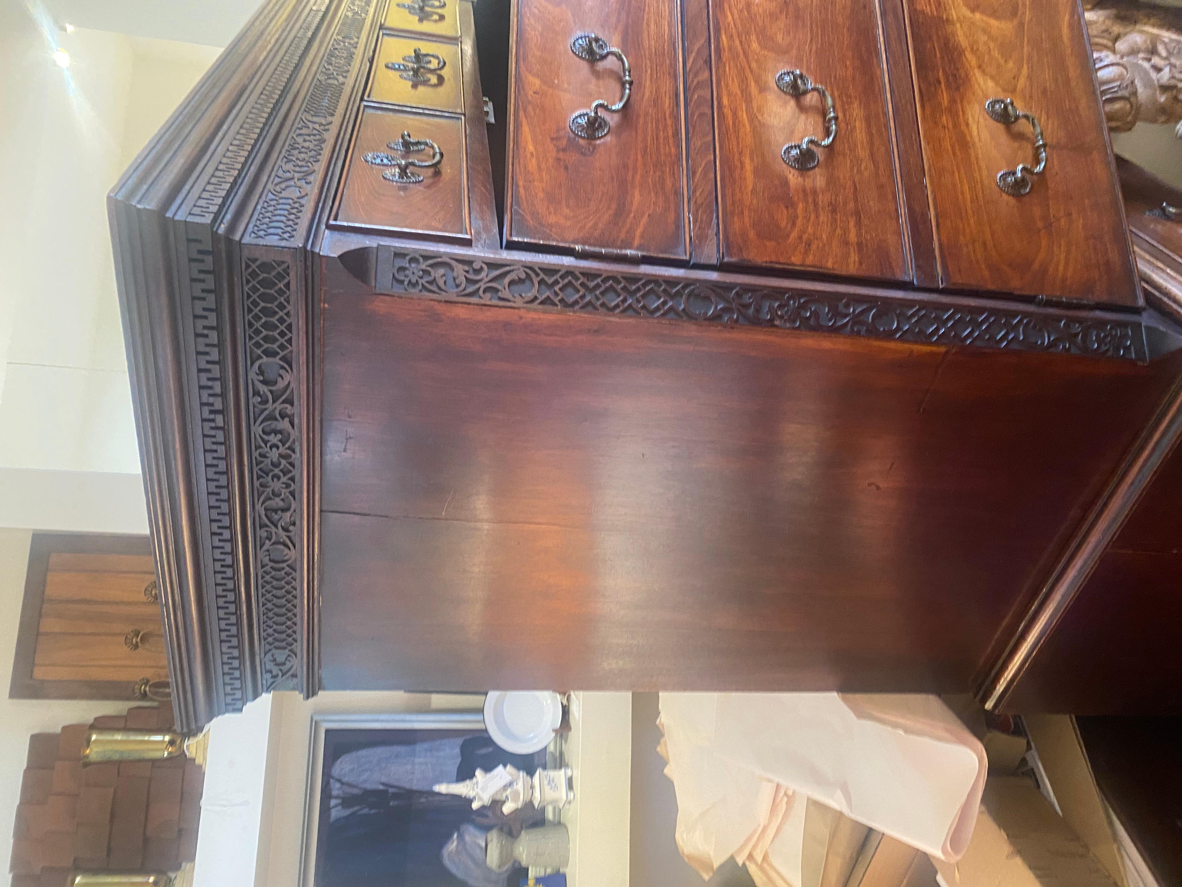 English A George III mahogany chest on chest with applied blind fretworadpated as a bar. For Sale