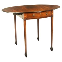 Una mesa Pembroke de caoba de Jorge III