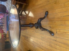 A George III mahogany side table with well patinated, dished, circular top.