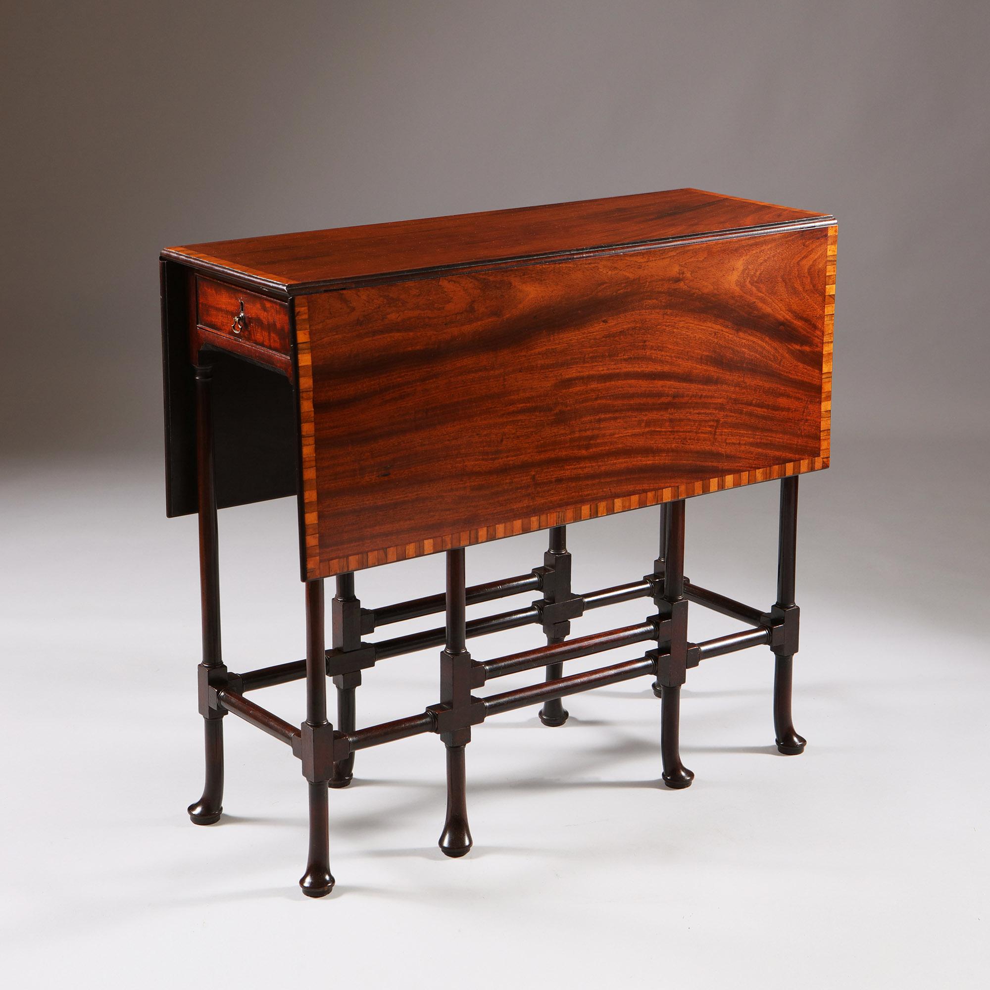 An Important George III mahogany spider-leg table attributed to Thomas Chippendale
1768. England

The tulip banded rectangular mahogany drop-leaf top with gateleg action, on a straight mahogany frieze with oak lined cockbeeded drawers to each short