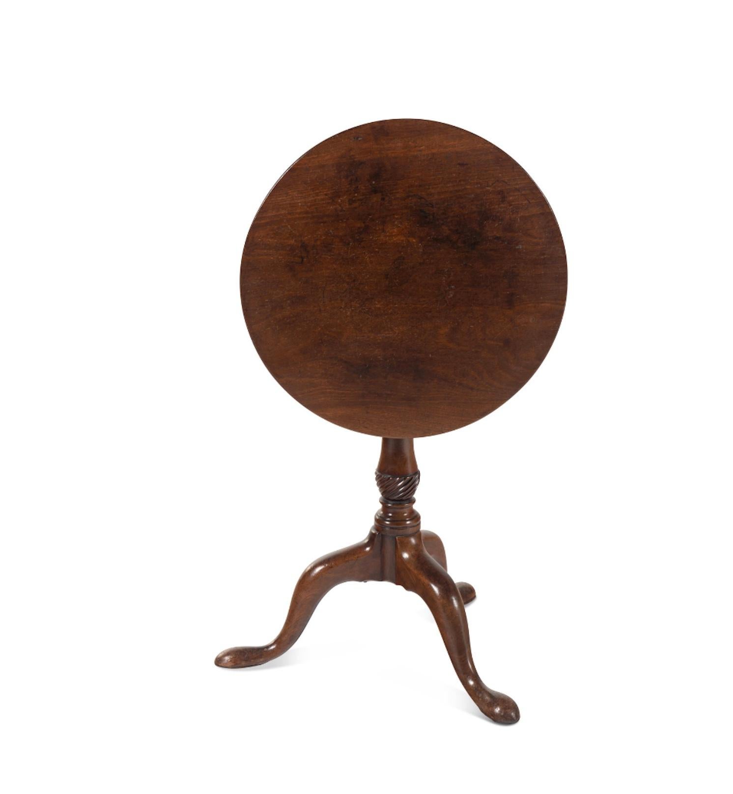 A George III Mahogany Tilt-Top Table
18th Century.  Great color and patination.
Height 26 x diameter of top 21 1/2 inches.
