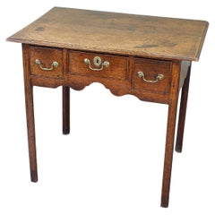 A George III Oak Lowboy