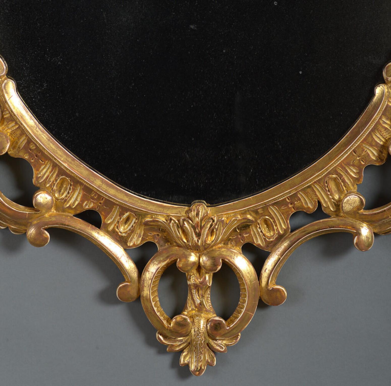 Carved A George III oval Chippendale mirror For Sale