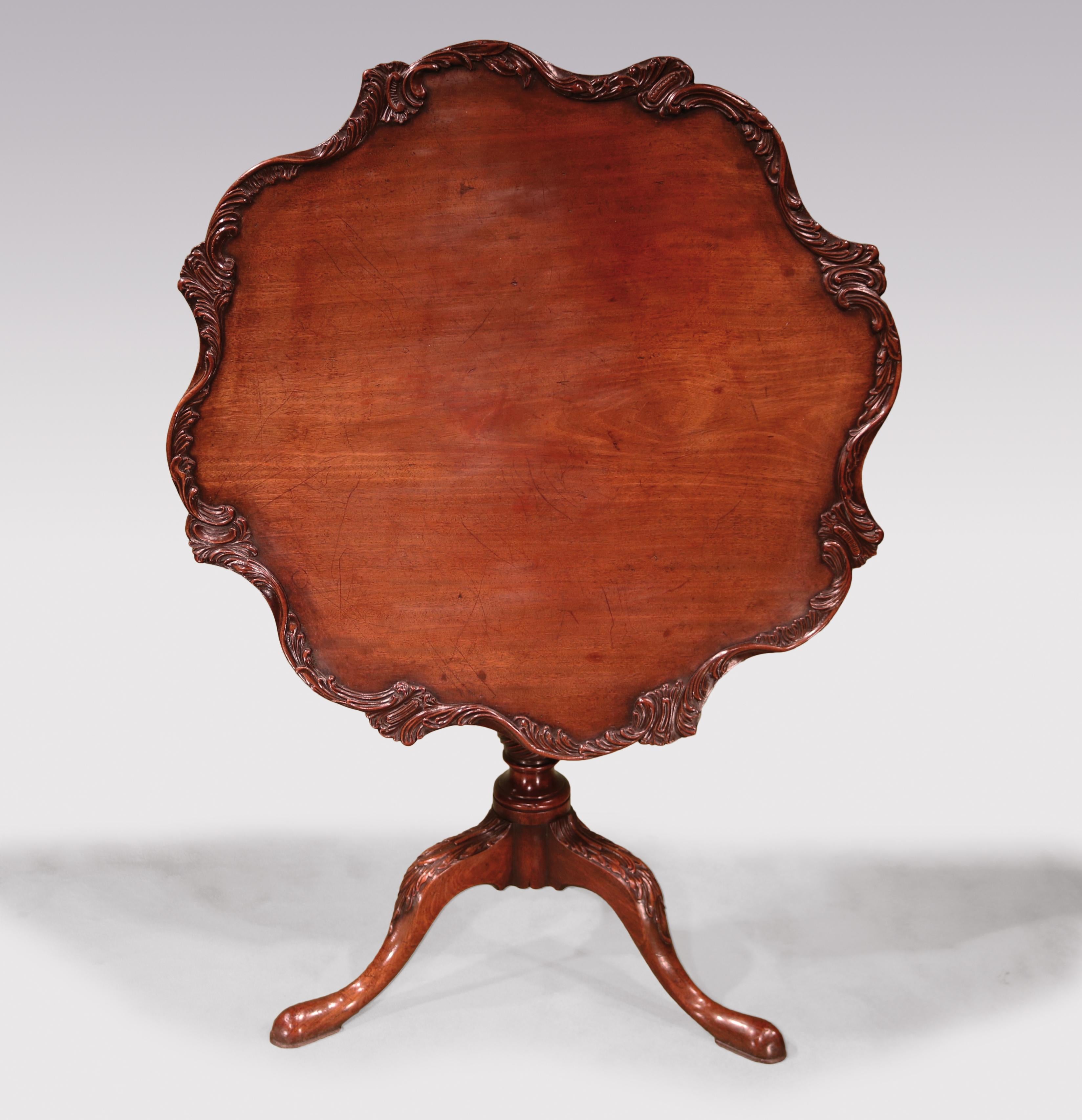 A fine and rare mid-18th century Chippendale period mahogany Tripod Table, having 8 differing rococo carved edge sections, supported on fluted spiral twist stem ending on acanthus carved legs with pad feet. (Block repositioned).