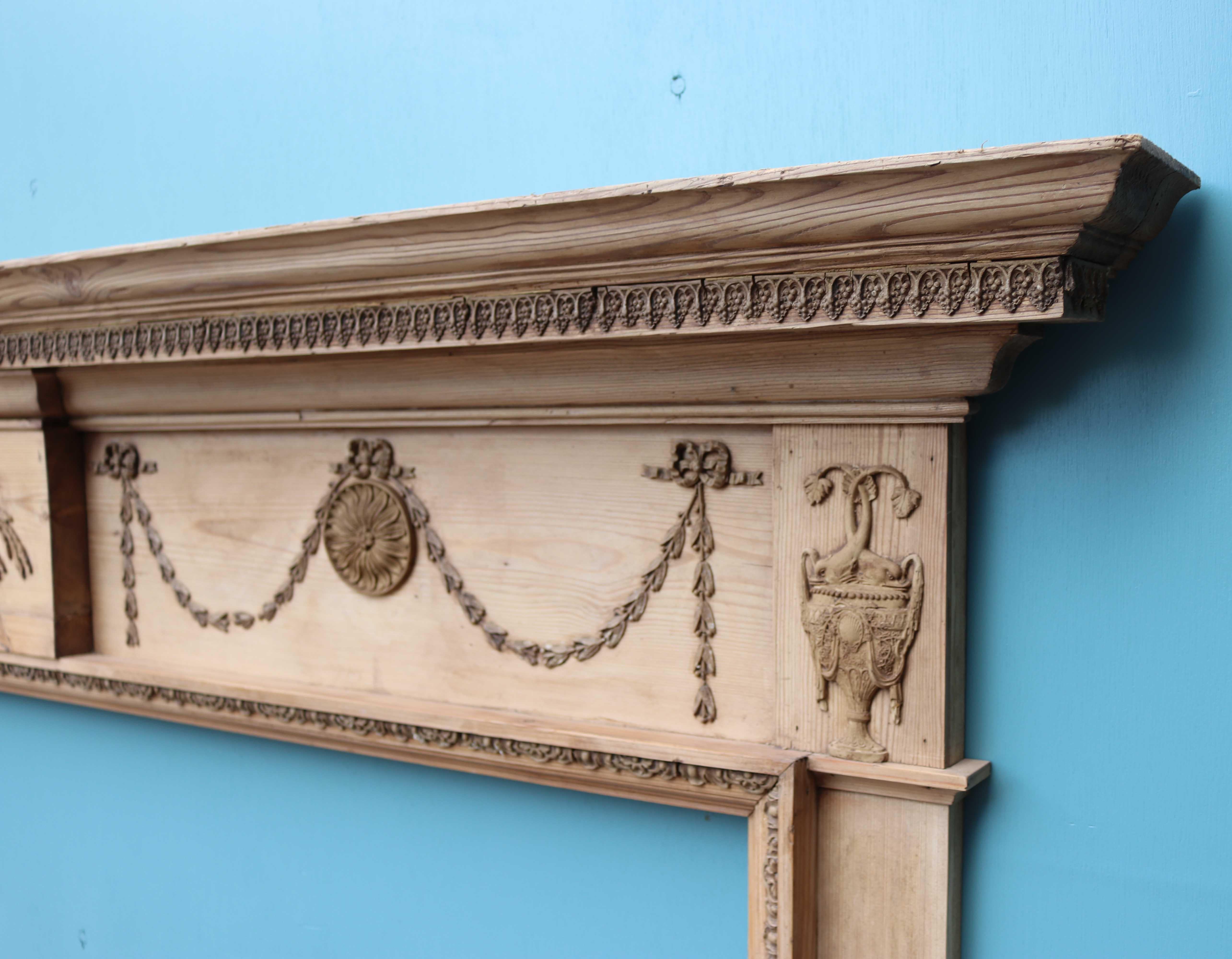 A very wide George III pine fire surround with composition (Gesso) detailing.

Additional Dimensions:

Opening Height 116 cm

Opening Width 170 cm

Width between outside of legs 198.5 cm.