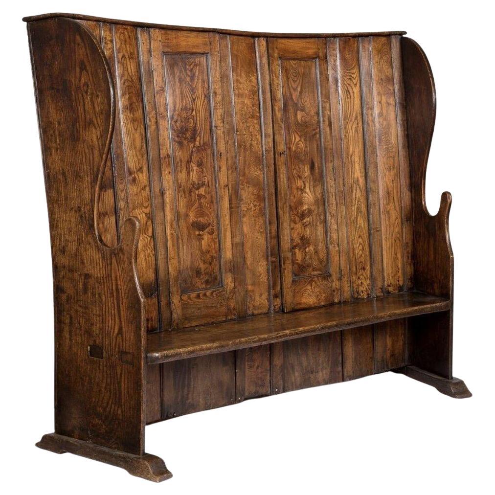 A George III Provincial Elm Bacon Settle, 18th Century For Sale