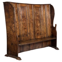 A George III Provincial Elm Bacon Settle, 18th Century