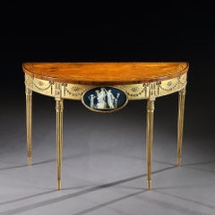 A George III Satinwood Marquetry Giltwood and Composition Demi-Lune Side Table
