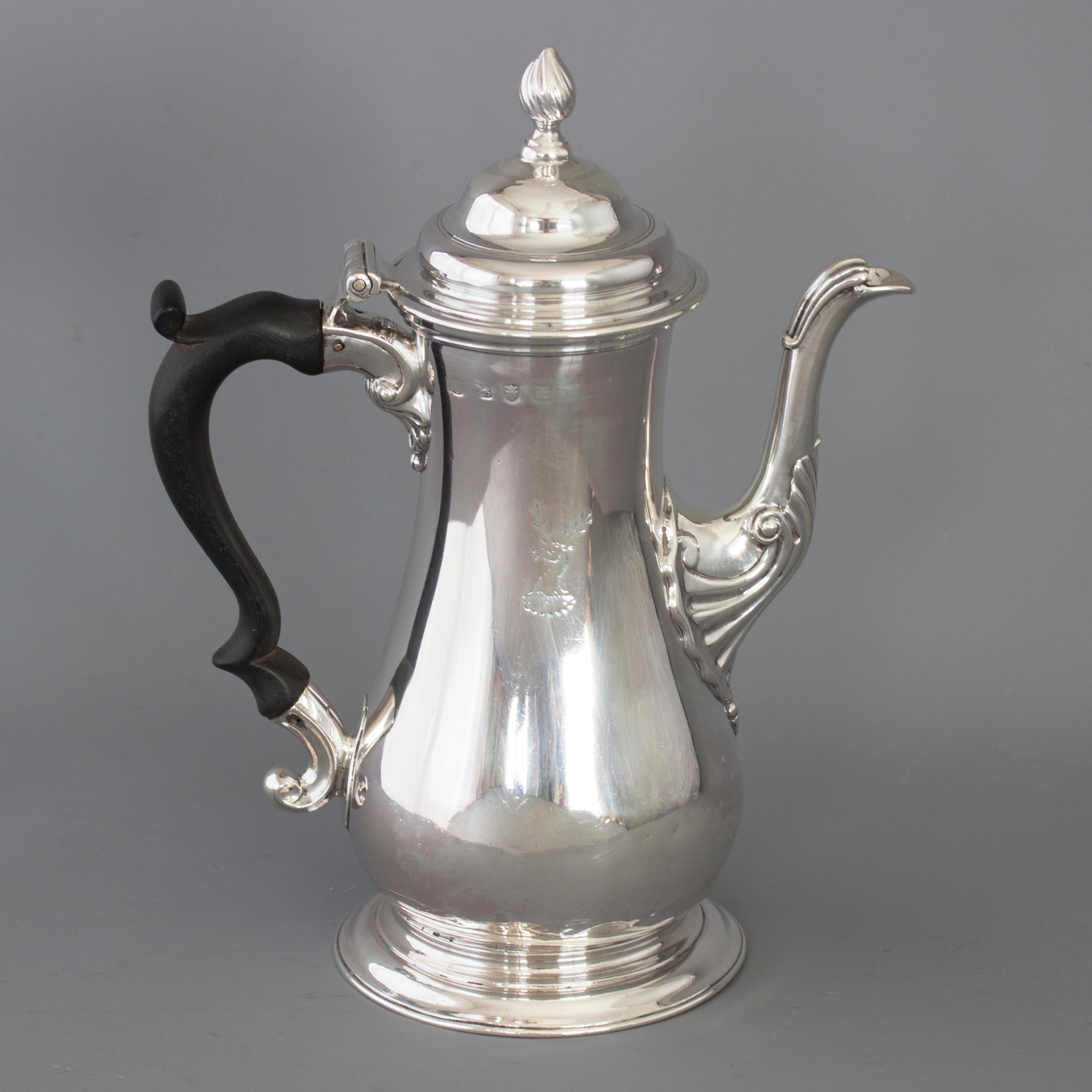 A very good Georgian silver coffee pot of baluster form with a cast swan-neck spout, pedestal foot and ebonized handle. The domed lid with a spiral finial. 
 
Marked to the body for London 1763 by William Grundy. Marked to the lid with the lion