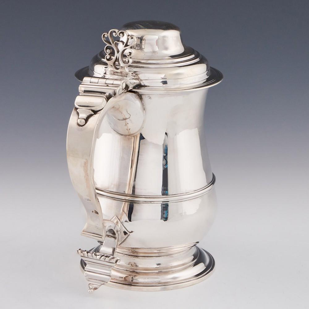 A George III Sterling Silver Domed Lidded Quart Tankard London, 1766

Additional information:
Date : Hallmarked in London 1765 For I*M ( John Muns, Jacob Moore or other)
Period : George III
Origin : London England
Decoration : Double c scroll