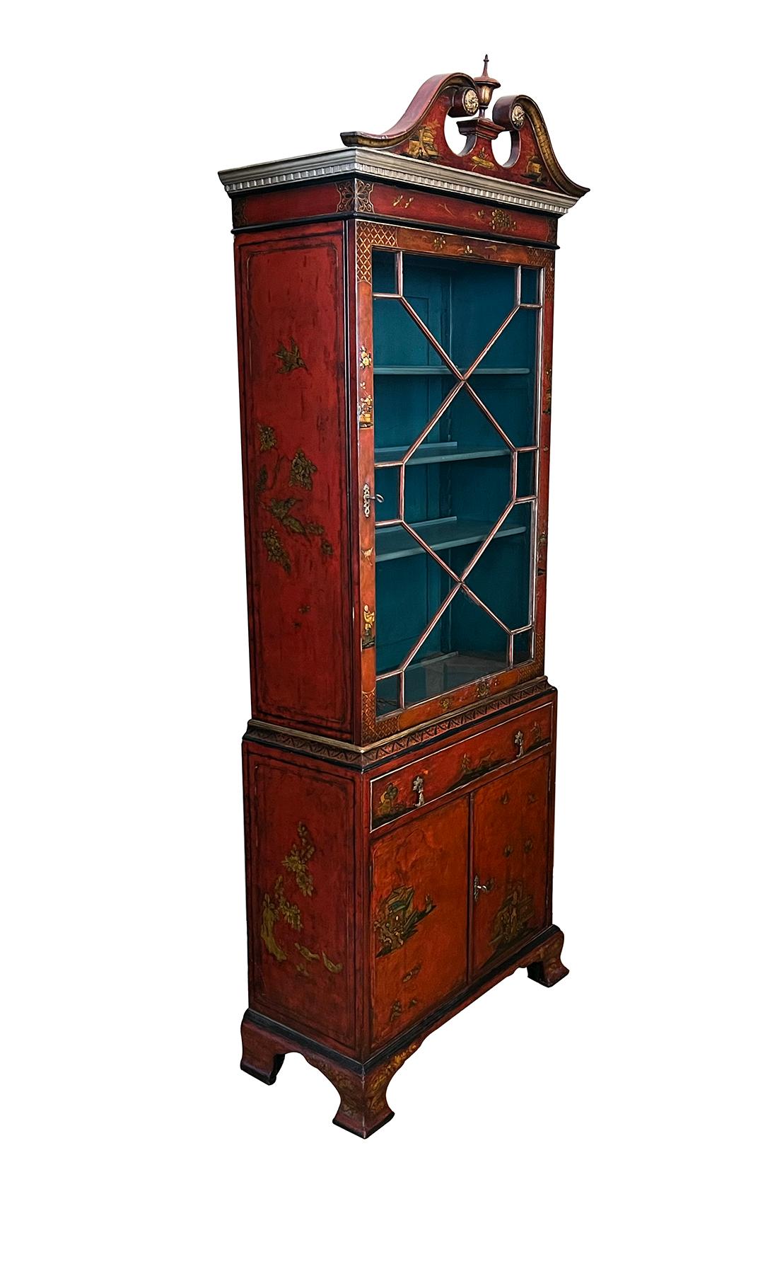 with goose neck pediment above a glazed cabinet resting on a base fitted with a single drawer over two doors; nicely decorated overall with various scenes; areas of refreshed gilding and paint; good antique condition 
