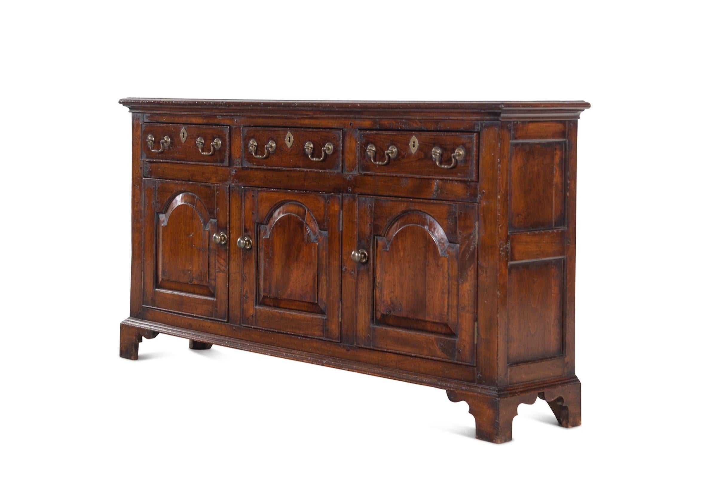A George III Style Walnut Serving Cabinet
19th Century elements.  Great Scale For Storage, Spectacular Color And Pantination.
Height 31 x width 60 x depth 13 inches.