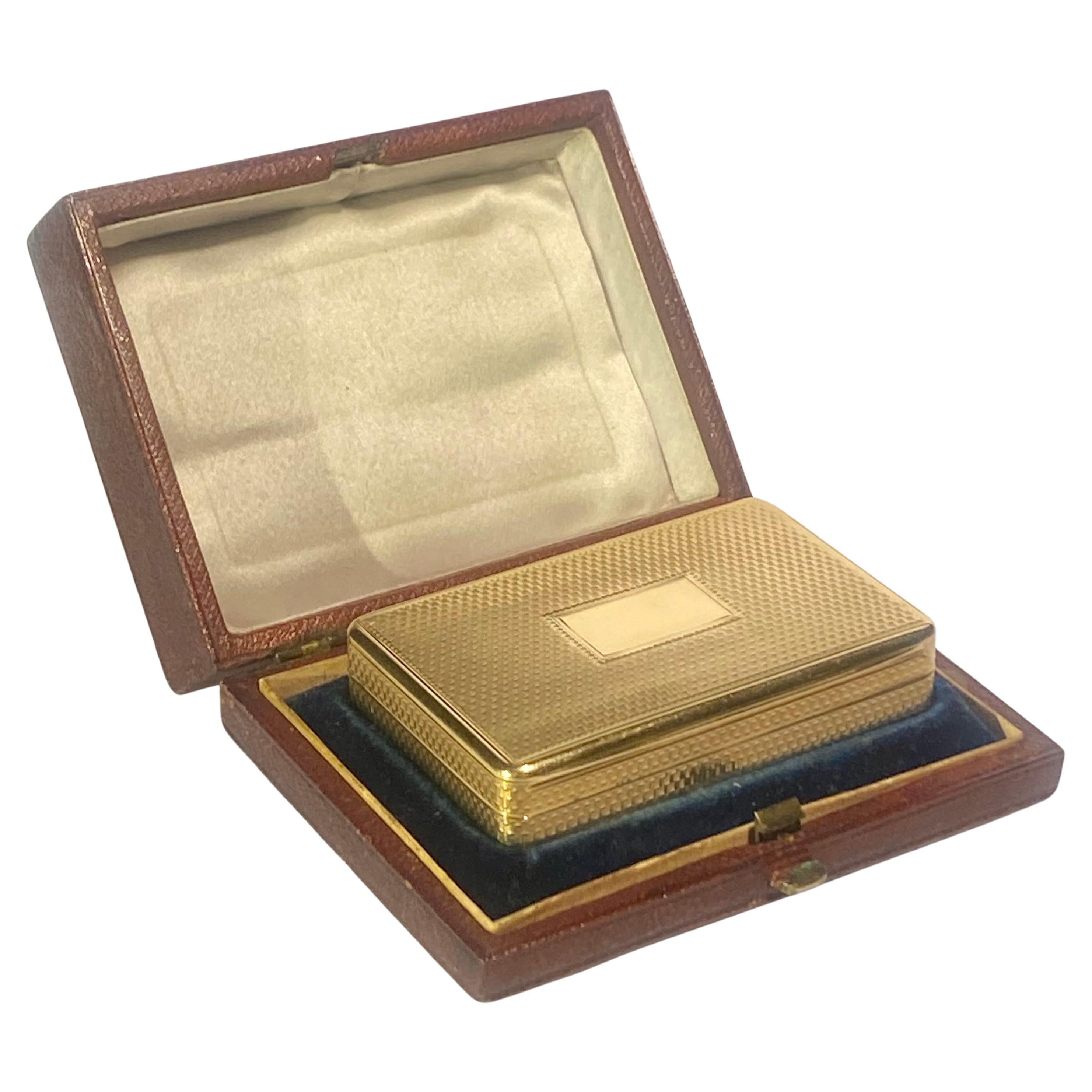 A good George IV 18ct gold rectangular snuff box by John Linnet, London, 1821,  A rectangular box, the hinged cover, sides and base with engine-turning, the cover centred with an oblong reserve simple thumbpiece, 
Size: 2.8 inches. (70 mm.) wide  by