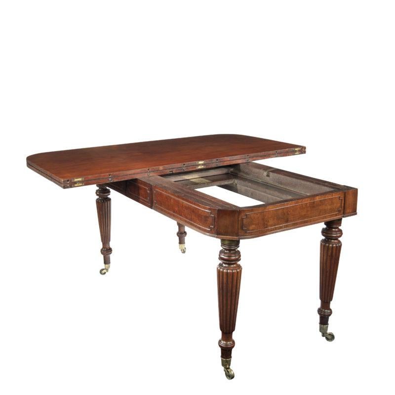 English A George IV campaign dining table by Charles Stewart with five additional leaves For Sale
