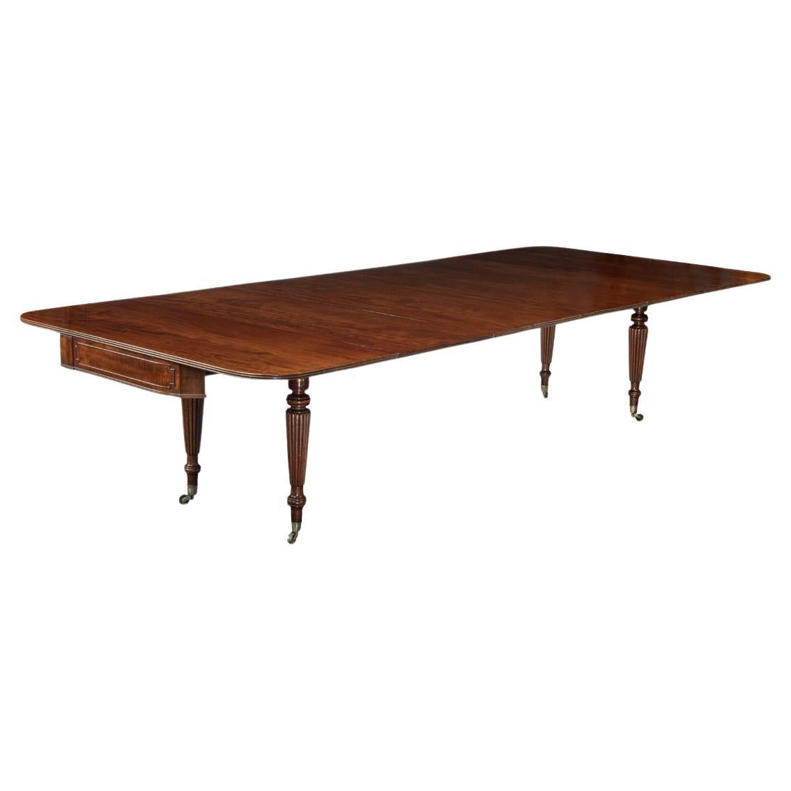 A George IV campaign dining table by Charles Stewart with five additional leaves For Sale