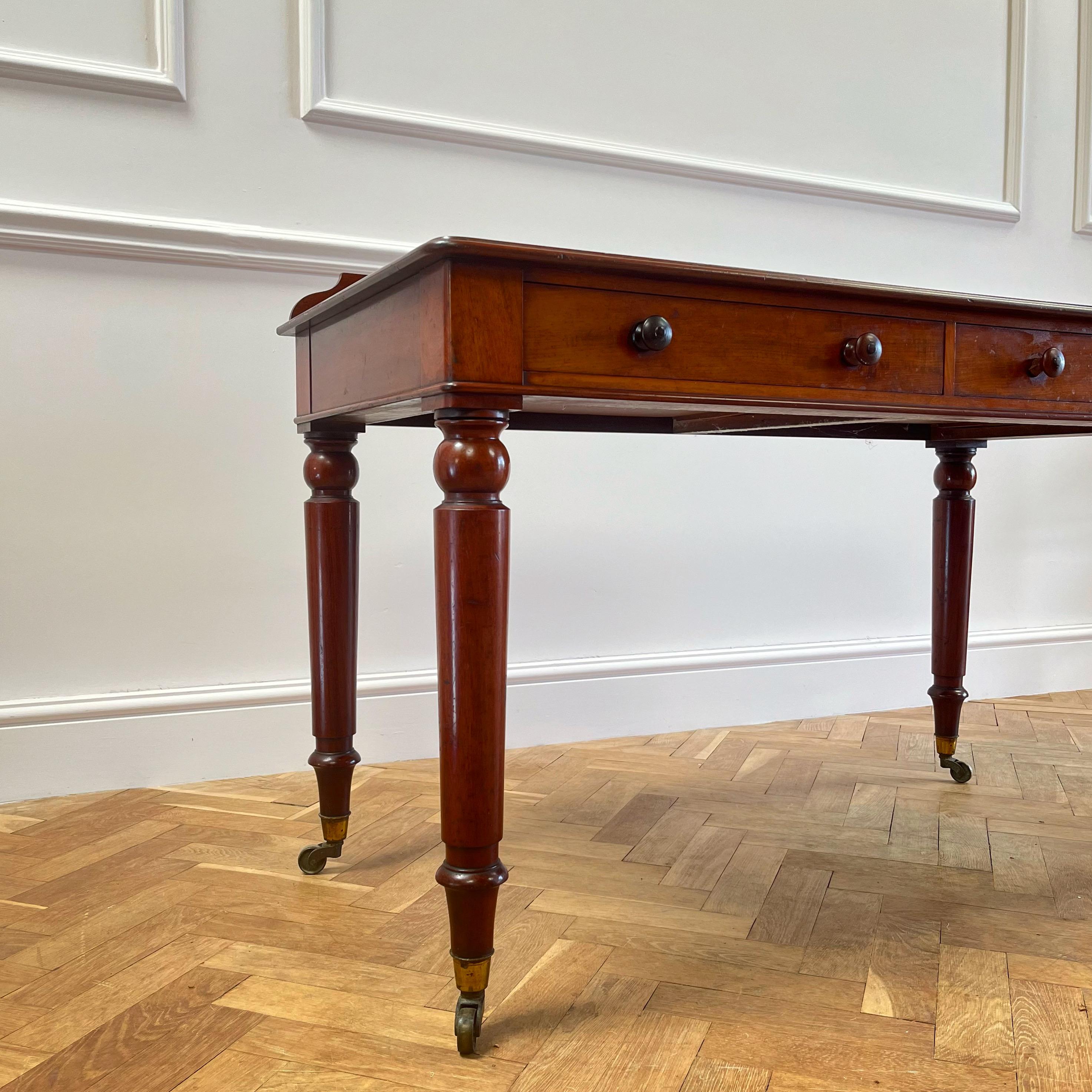 A very fine mahogany writing table on four masculine legs, terminating in cope castors with two drawers above, deep rich timber top with stamp.

England, 1820

H 80 x W 122 x D 57 cms (seat clearance 60 cms)

Inquire about this piece