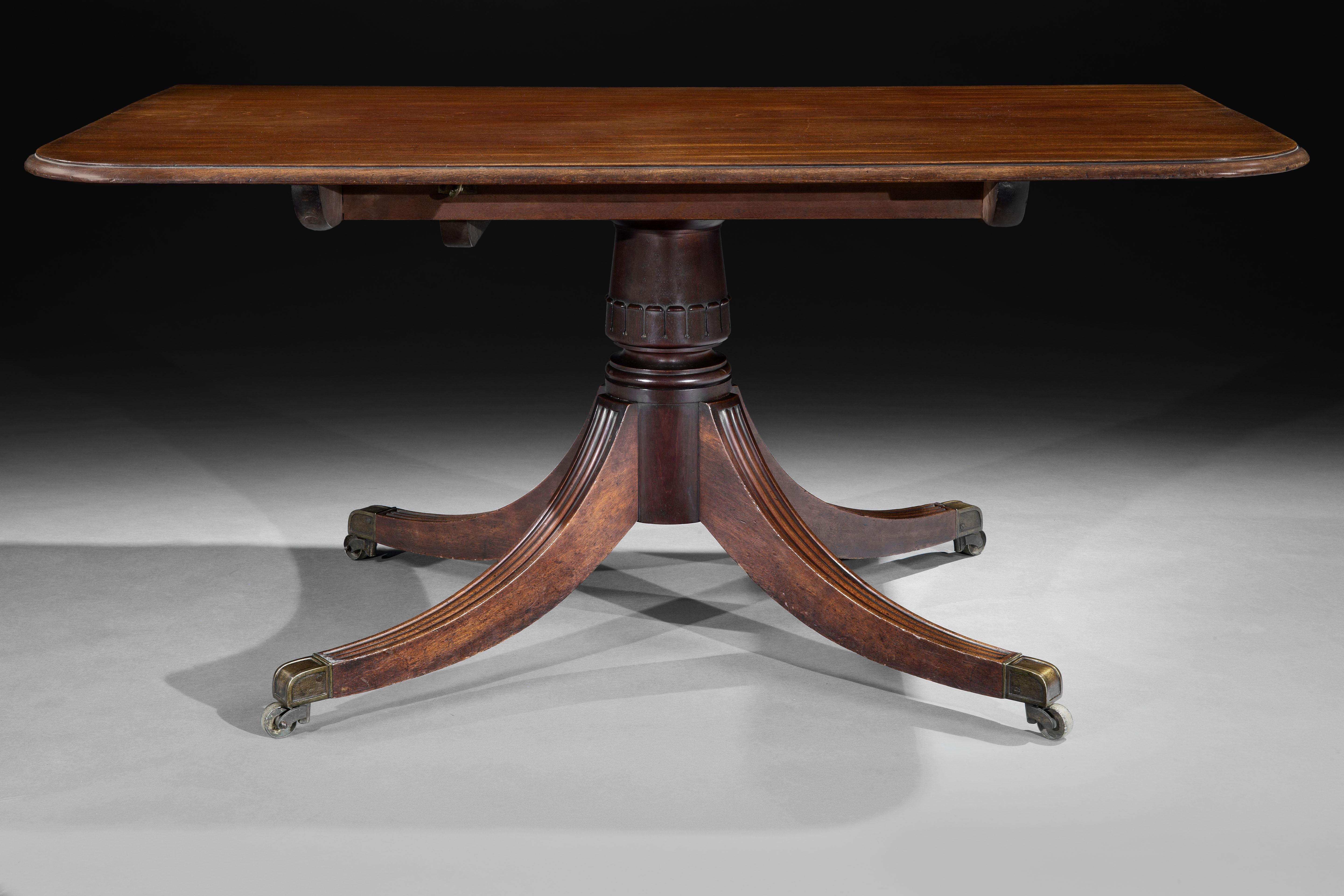 Carved A George IV Mahogany Three Pillar Dining Table For Sale