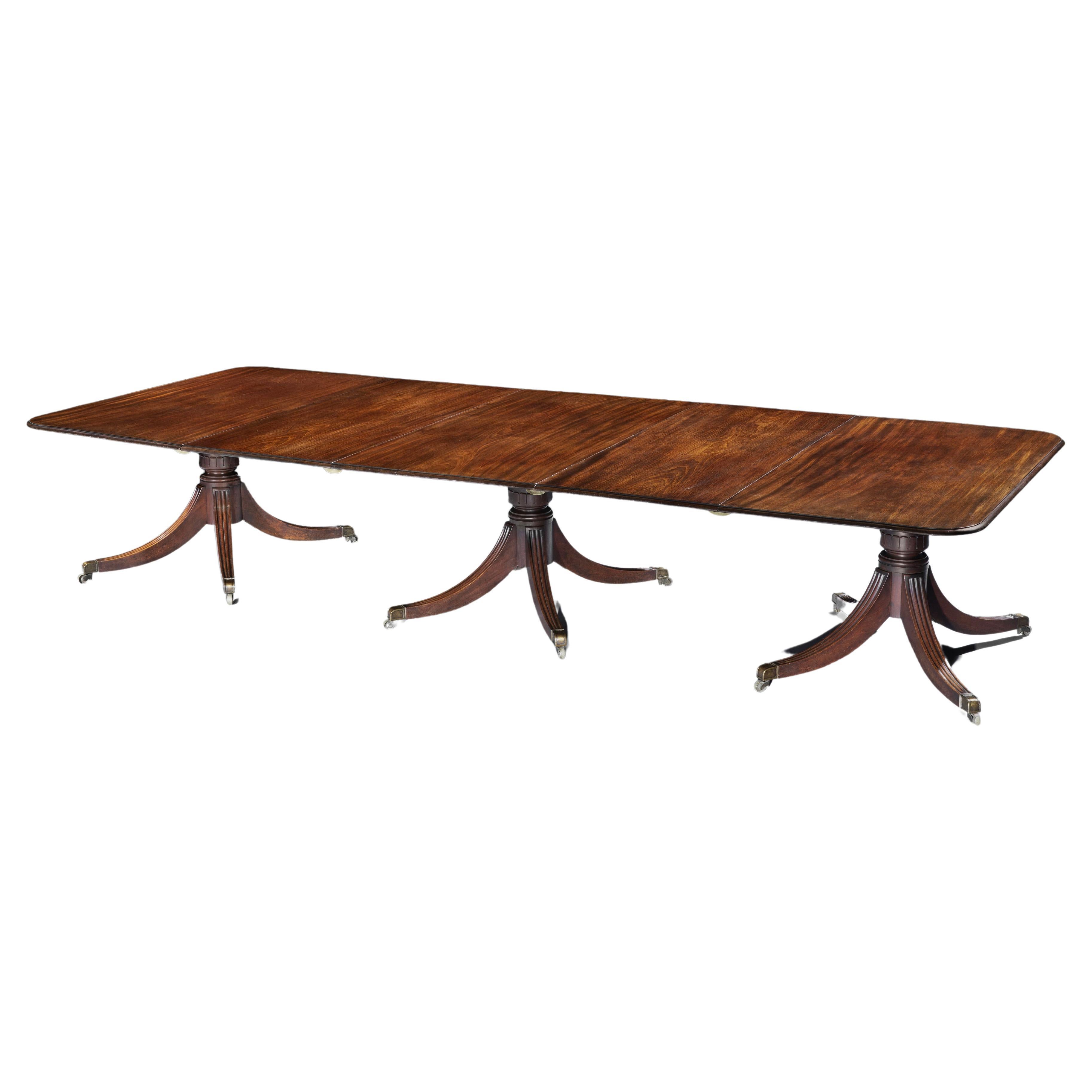 A George IV Mahogany Three Pillar Dining Table For Sale