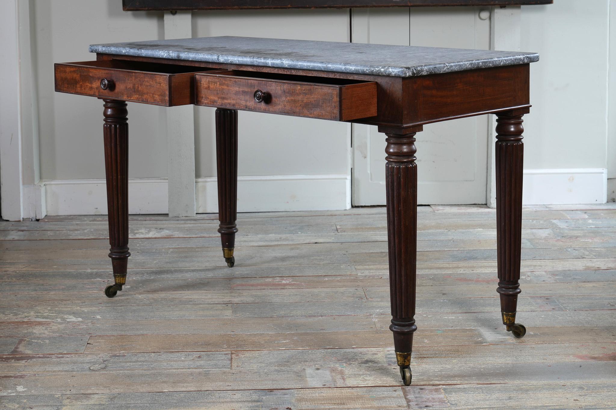 A George IV Mahogany Writing Desk with a Fossil Marble Top 5