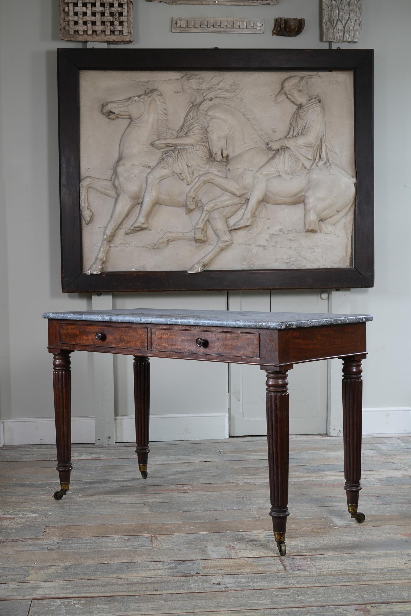 A George IV Mahogany Writing Desk with a Fossil Marble Top 6