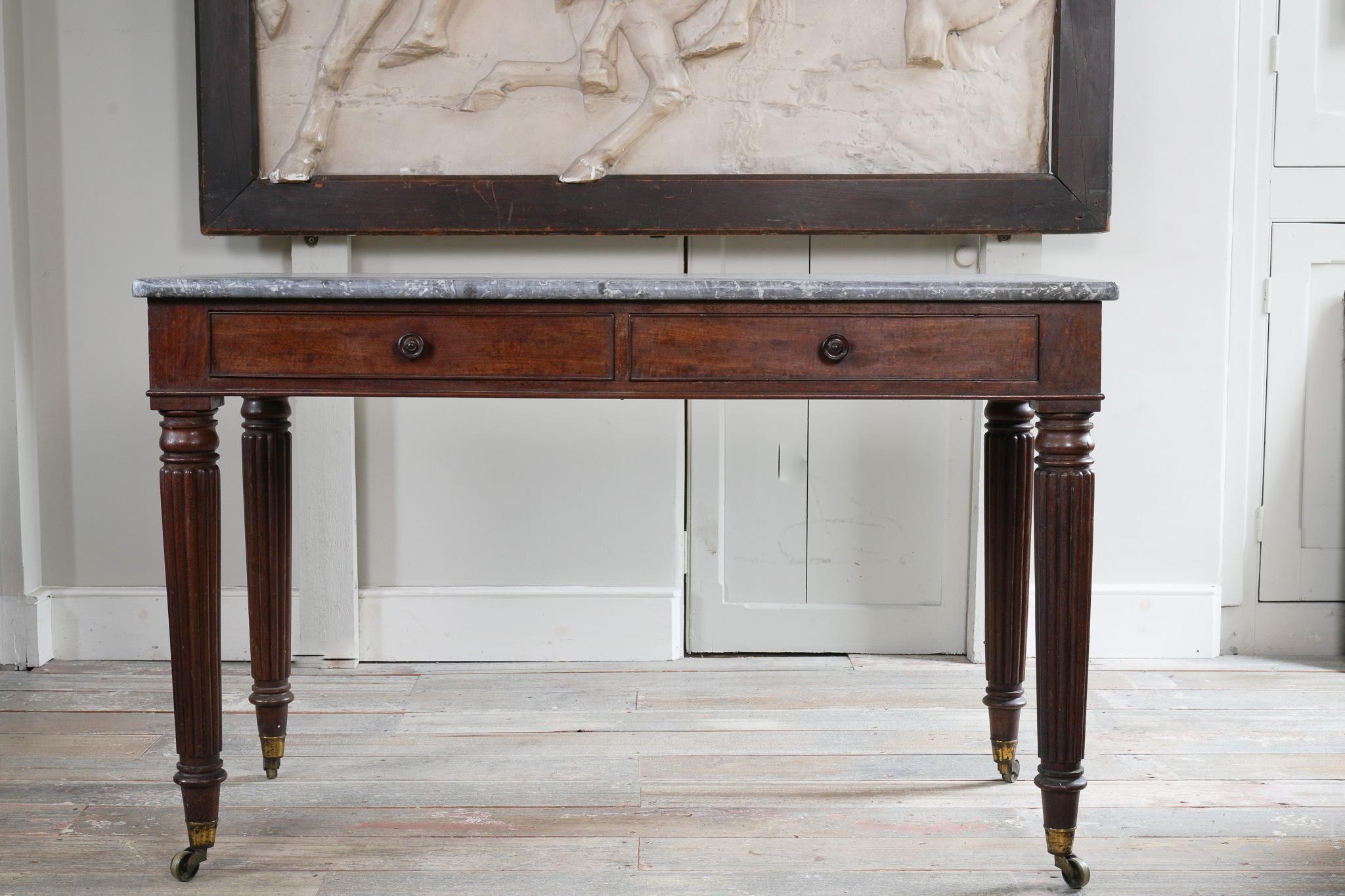 English A George IV Mahogany Writing Desk with a Fossil Marble Top