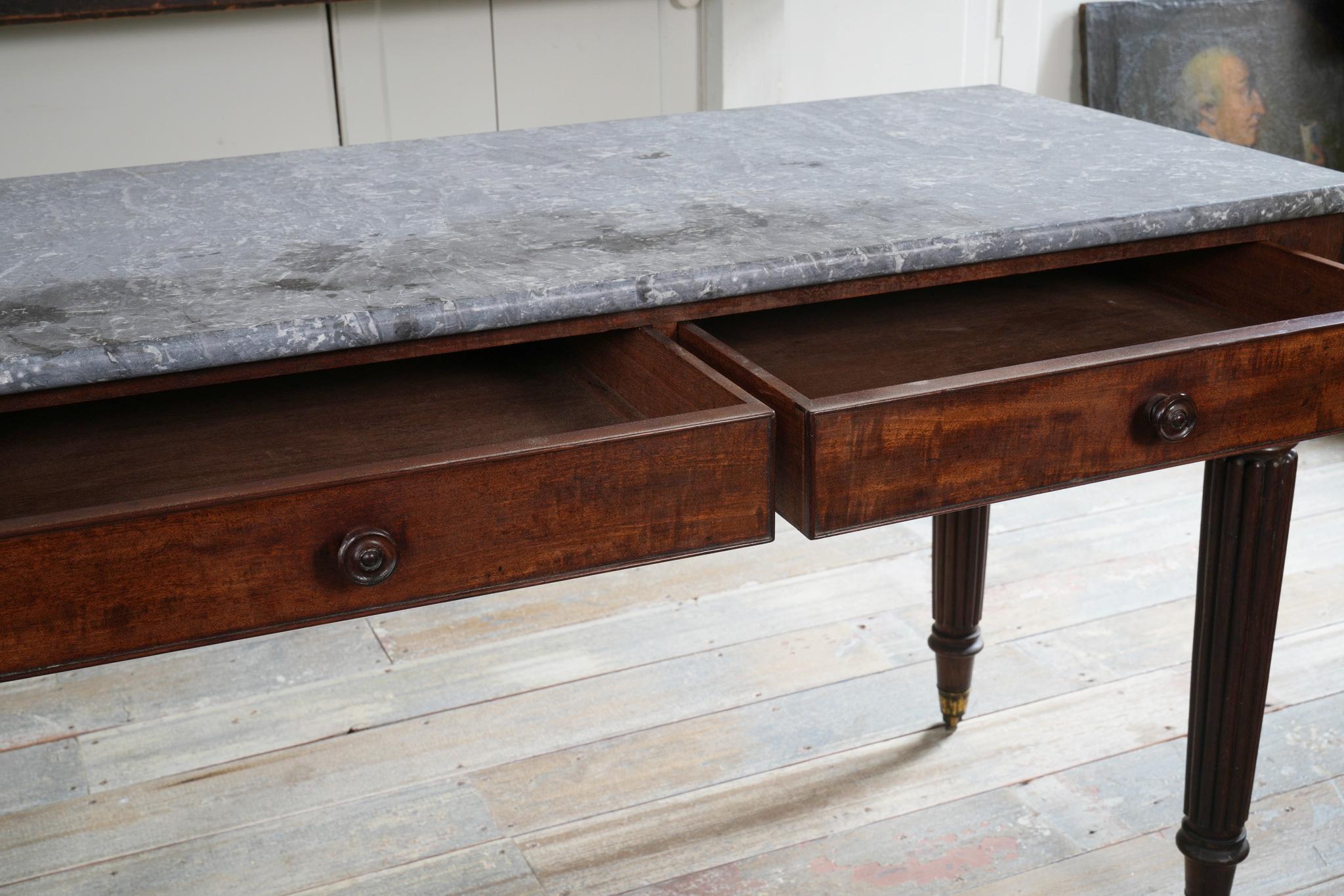 19th Century A George IV Mahogany Writing Desk with a Fossil Marble Top