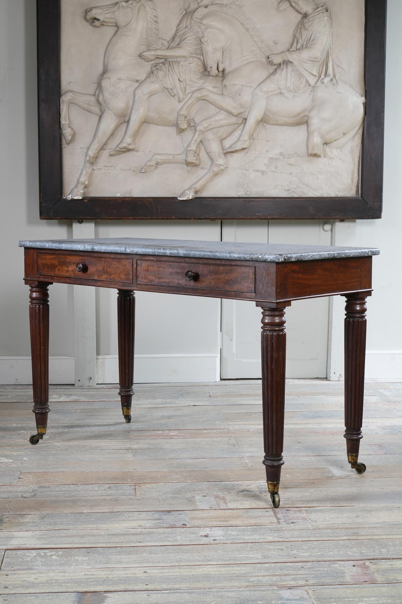 A George IV Mahogany Writing Desk with a Fossil Marble Top 4