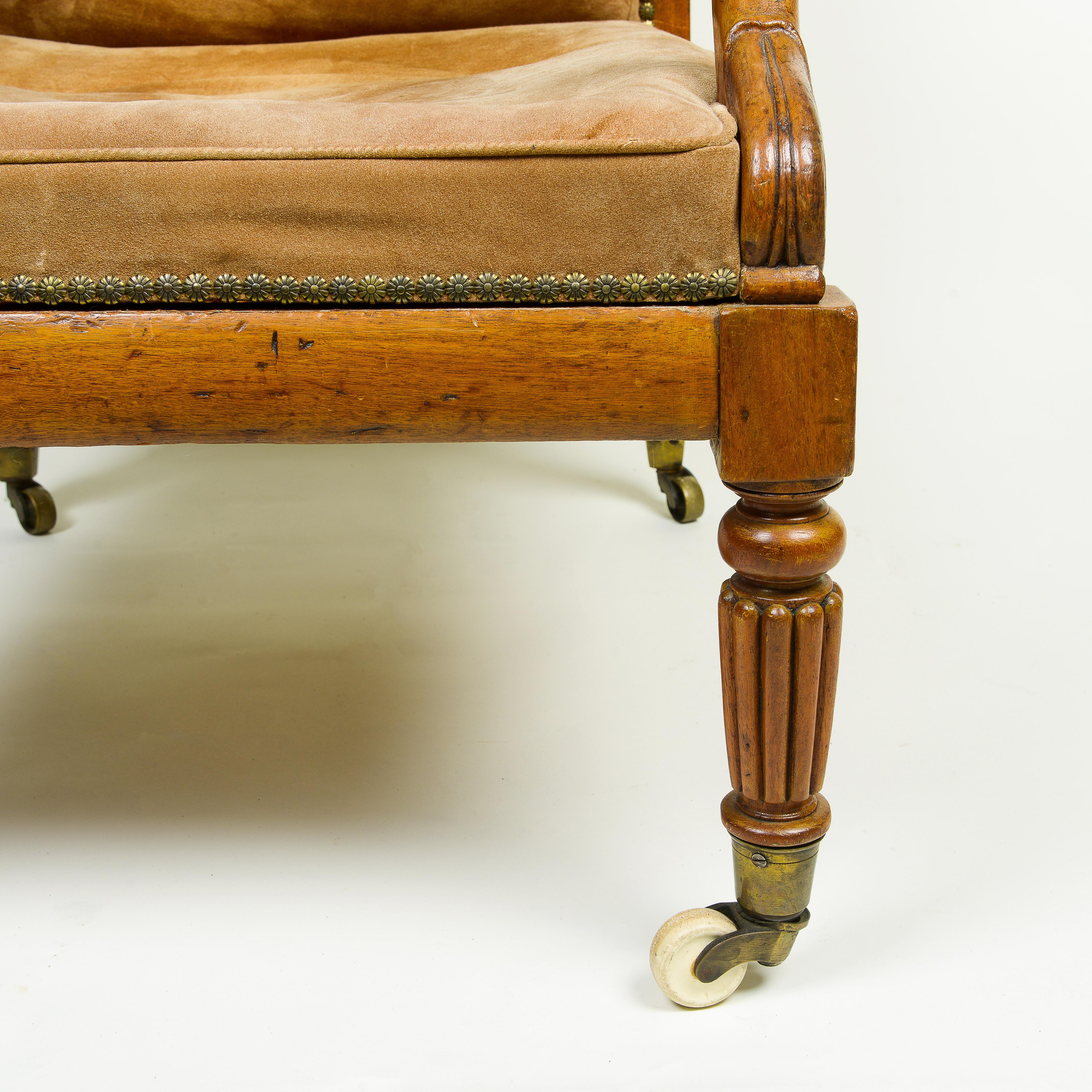 A George IV Walnut and Suede Library Armchair For Sale 4