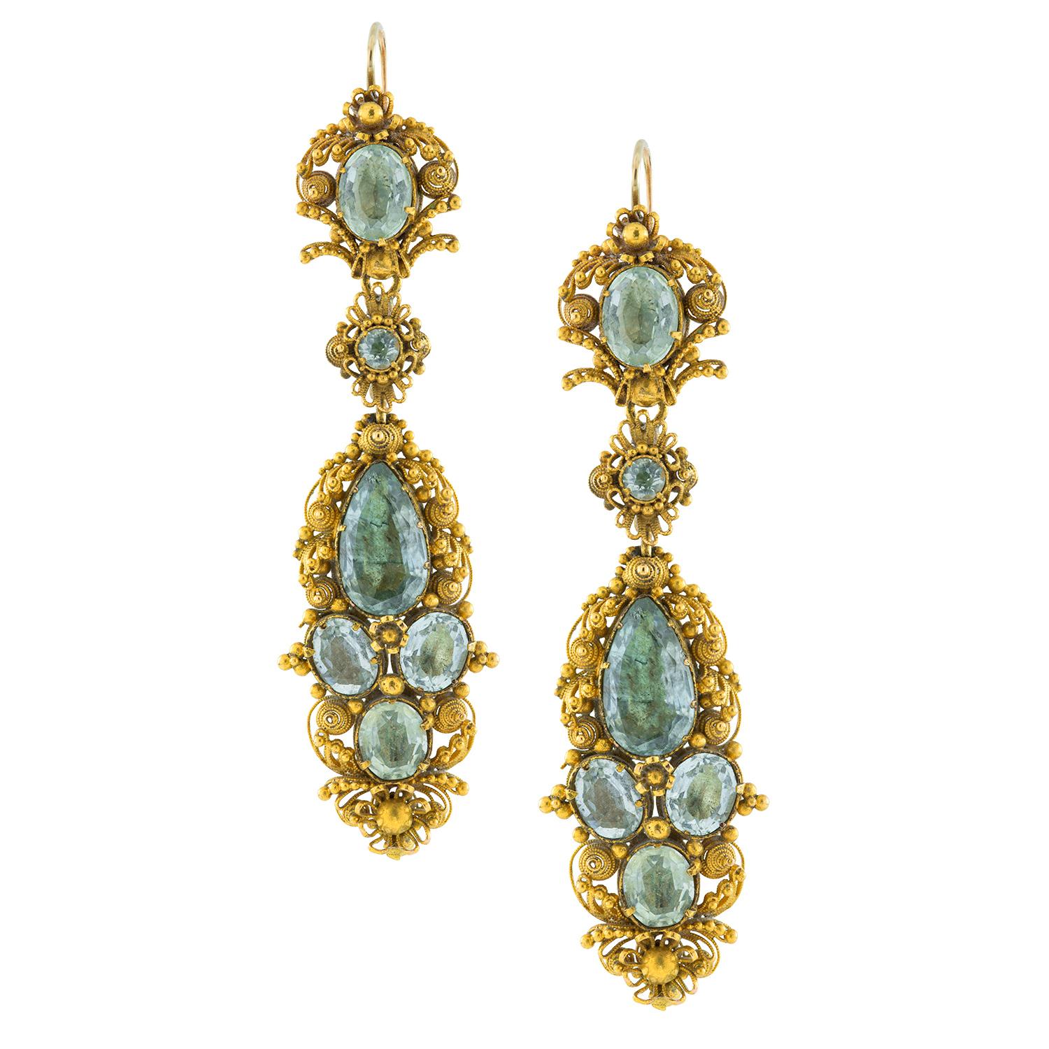 A Georgian aquamarine and gold cannetille suite, the necklace consisting of three emerald-cut aquamarine-set gold links, connected with two oval-cut aquamarine-set clusters, attached to a fine gold mesh chain by three floral links on each side, set