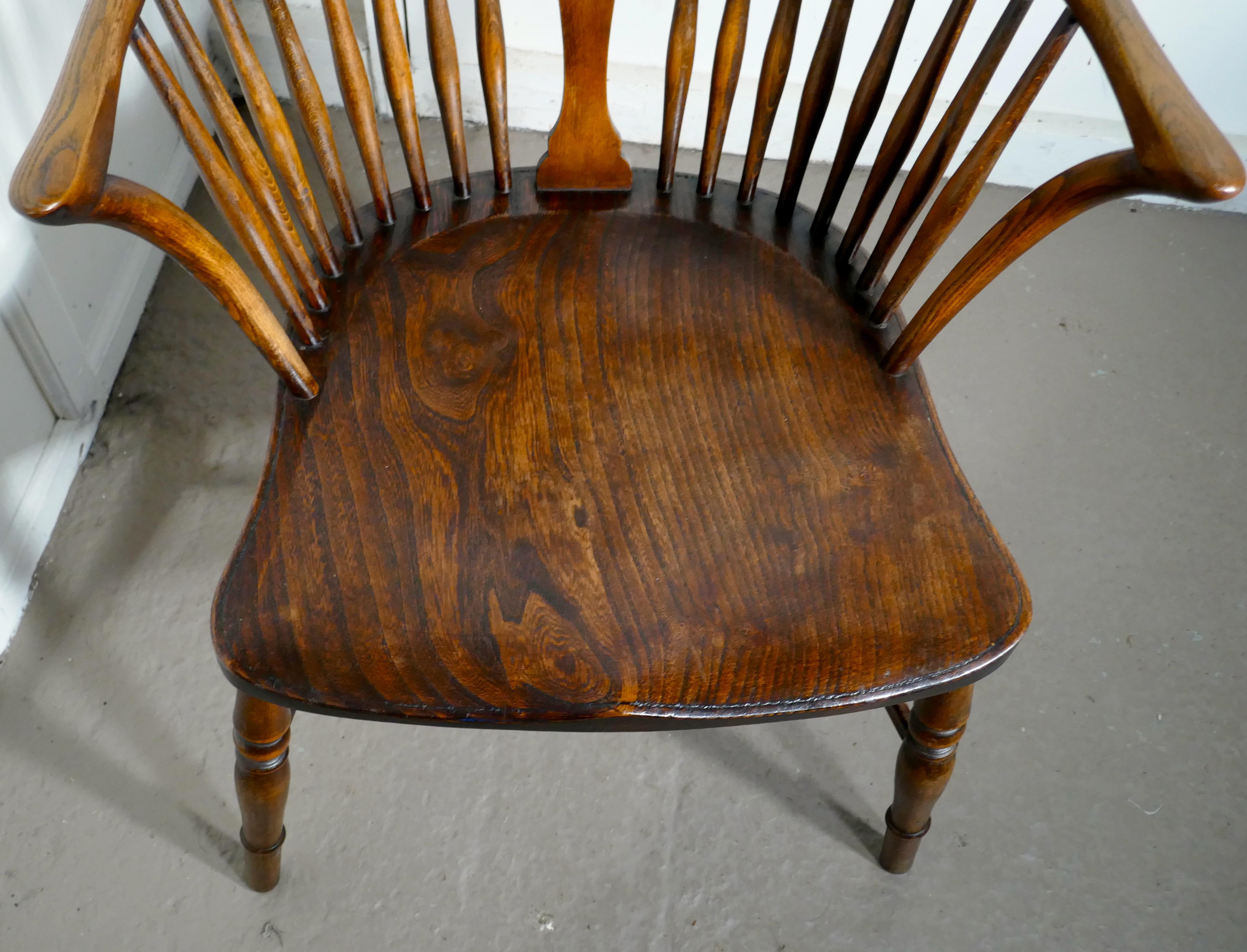 A Georgian elm and ash wheel back windsor carver chair

This is an early 19th century chair made from elm and ash it has a hooped back in the traditional Windsor style, it has a saddle shaped seat and a pierced central splat.
This is a good
