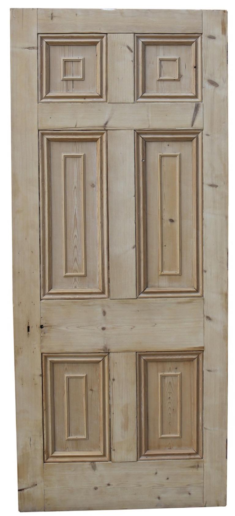 A George III period internal door. Constructed from pine, with a natural wood finish.