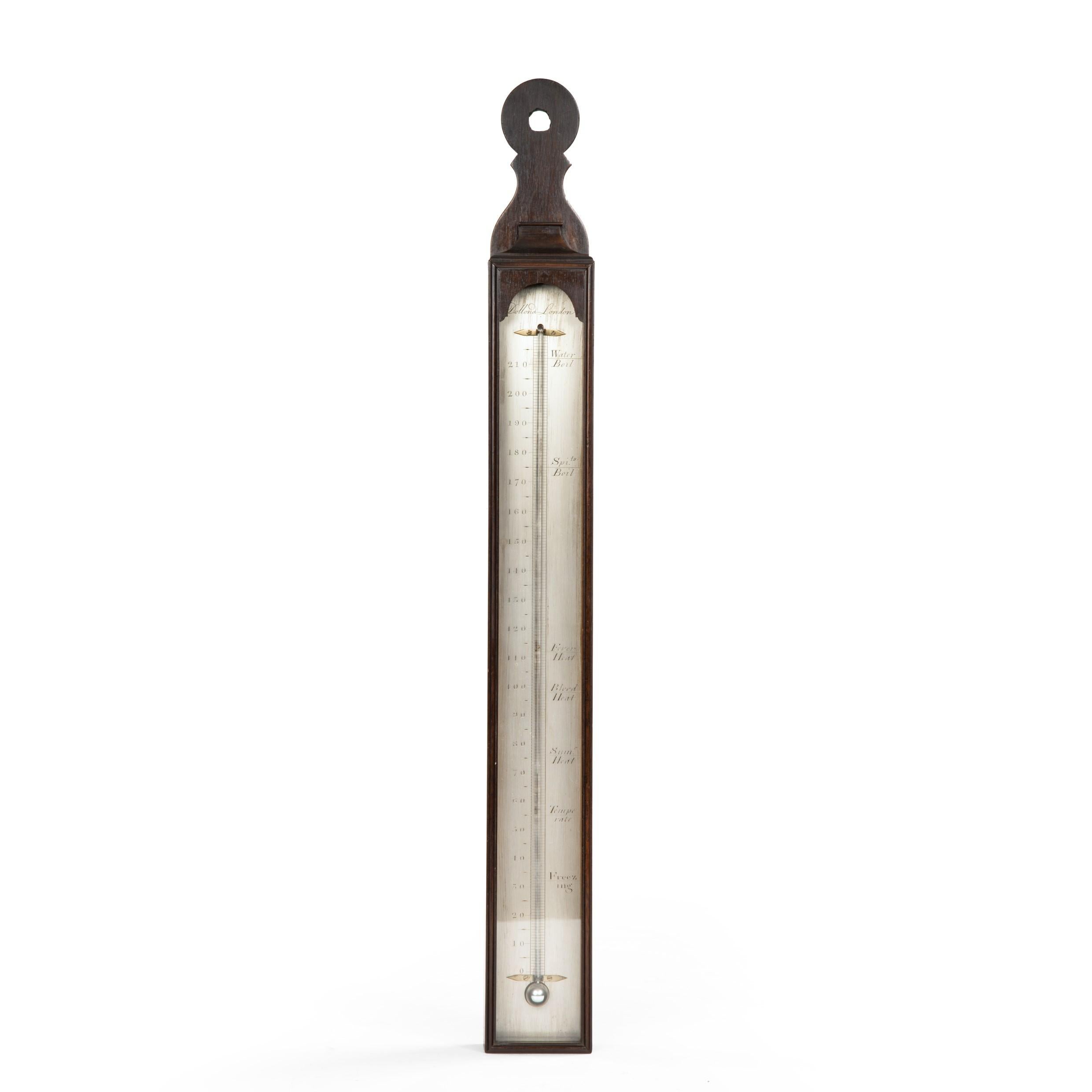 A Georgian III mahogany thermometer by John Dollond, of slender rectangular form, the top of the frame removable to aid the cleaning of the glass, with a silvered register engraved to the temperature 220 degrees (rather than the usual 110) and