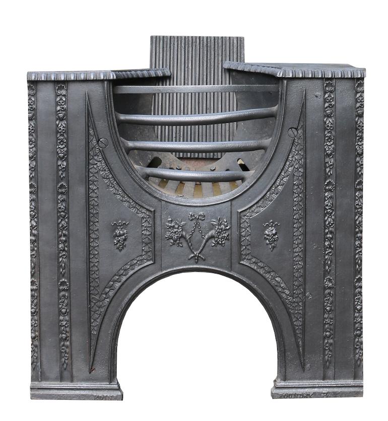 A good quality George III hourglass hob grate, finished in black graphite polish. An original from the English Georgian period, this antique hob grate is intricately cast, featuring floral embellishments throughout, looking beautiful alongside a