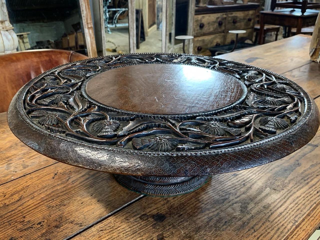 An early 19th century Lazy Susan made from carved Oak. It has beautiful detailed carvings including Thistles going around the top. It is most probably Scottish with the Thistles. It has a small repair to the base. A lovely quality piece.