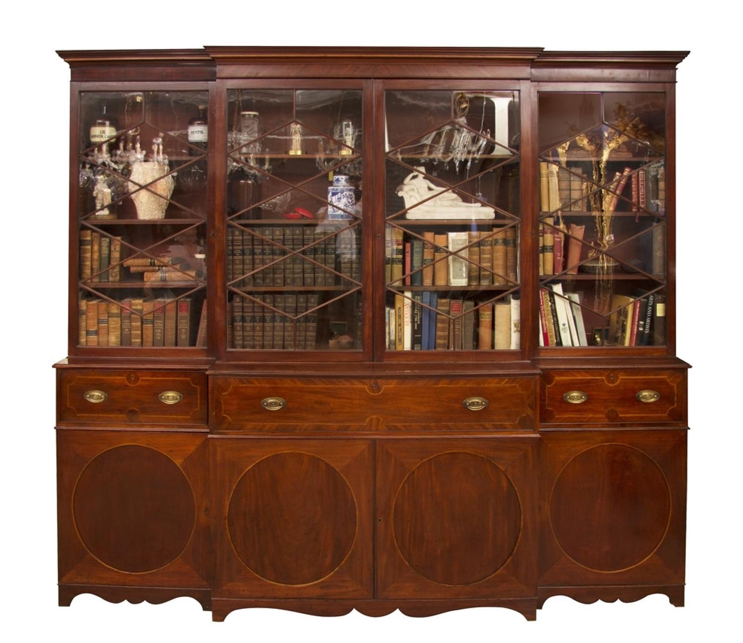 A George III Mahogany breakfront secretaire bookcase, circa 1780

A George III Mahogany breakfront secretaire bookcase. A wonderful Georgian bookcase with the original patina, color and tone you would want. A really lovely piece proportionally