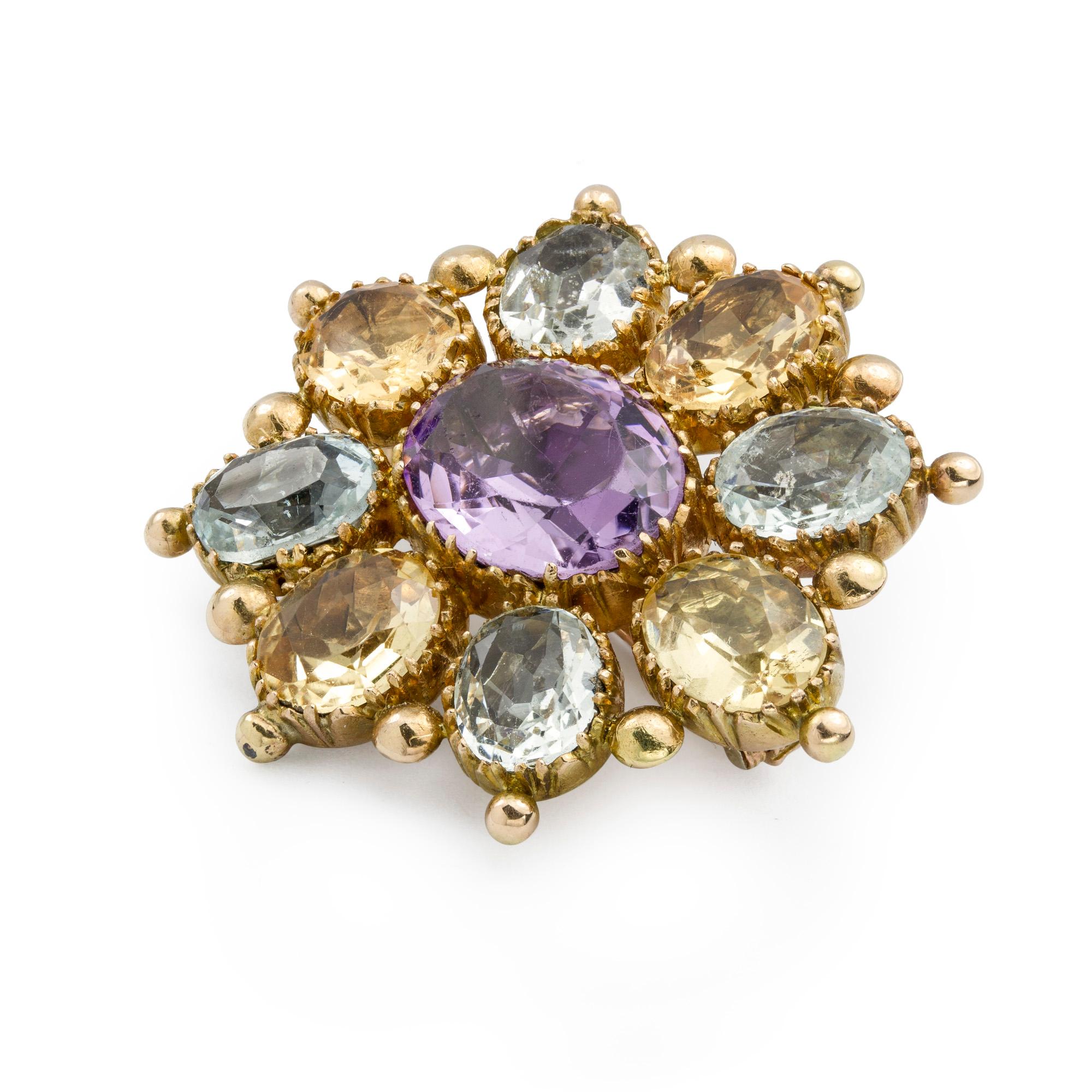 A Georgian multi-colour gem-set brooch, set with an oval amethyst to the centre to a border of citrine and aquamarine with gold ball detail set between each, measuring approximately 3.6cm x 3.2cm, all in 18ct yellow gold, circa 1830, gross weight