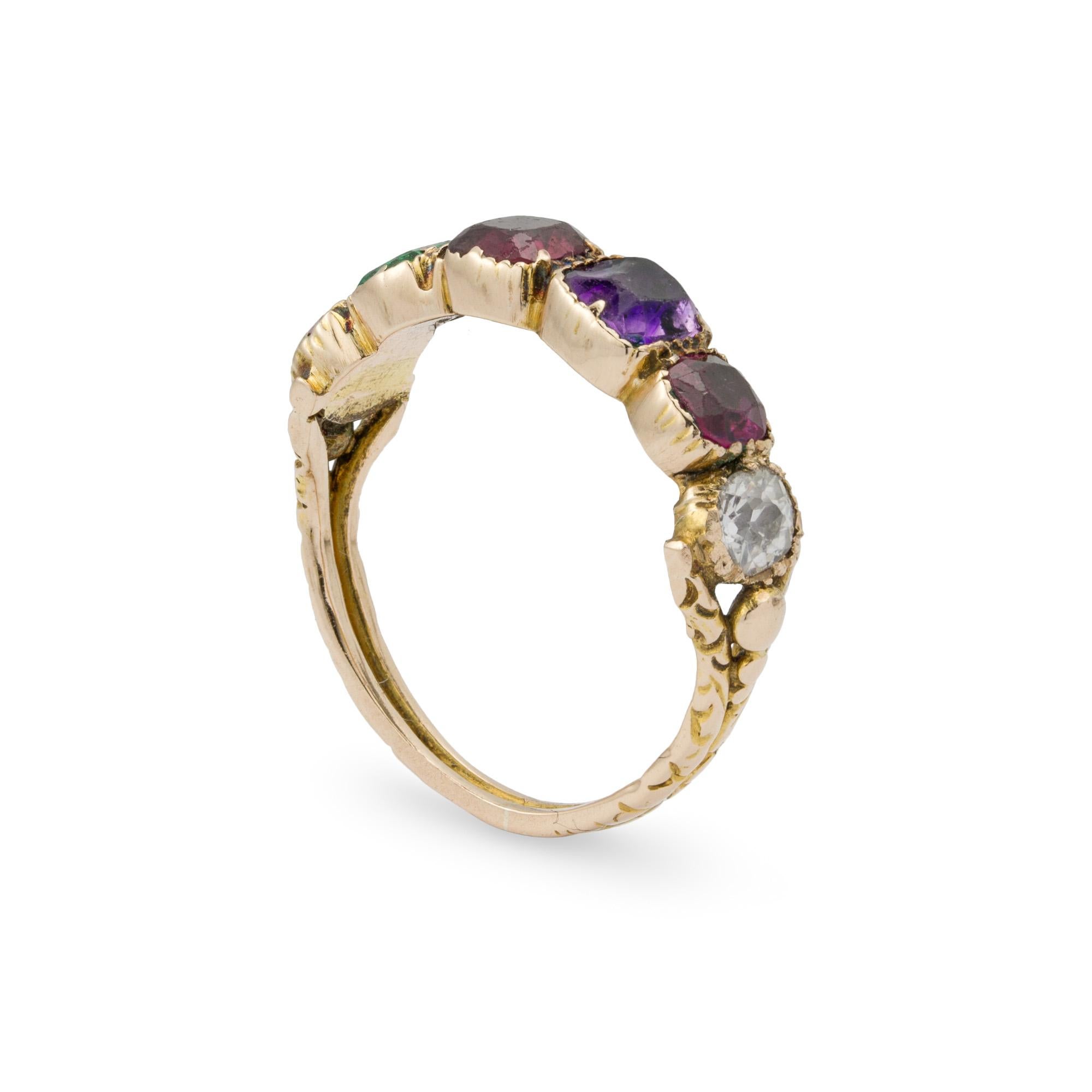 A Georgian regard ring, set with ruby, emerald, garnet, amethyst, ruby and diamond spelling REGARD, all in a closed back setting, with open-work shoulders to a decorated ribbed shank all in yellow gold, circa 1830, the head measuring 0.5x2cm, gross