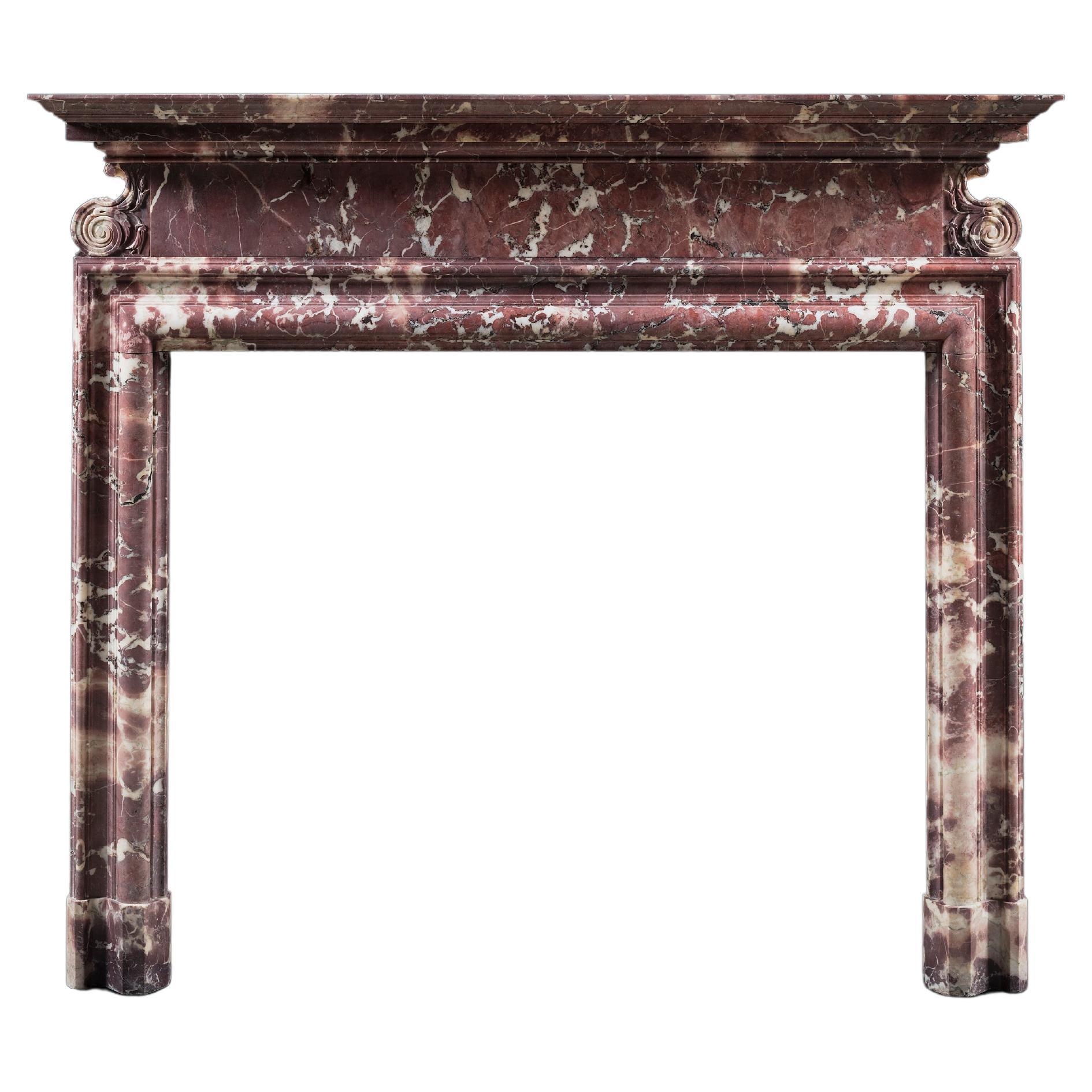 A Georgian Revival Bolection Chimneypiece Carved in Breccia Medicea marble For Sale