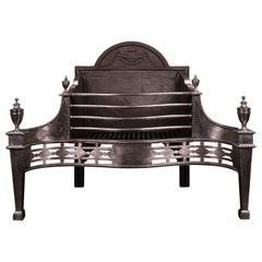 A Georgian Revival Polished Steel Fire Grate