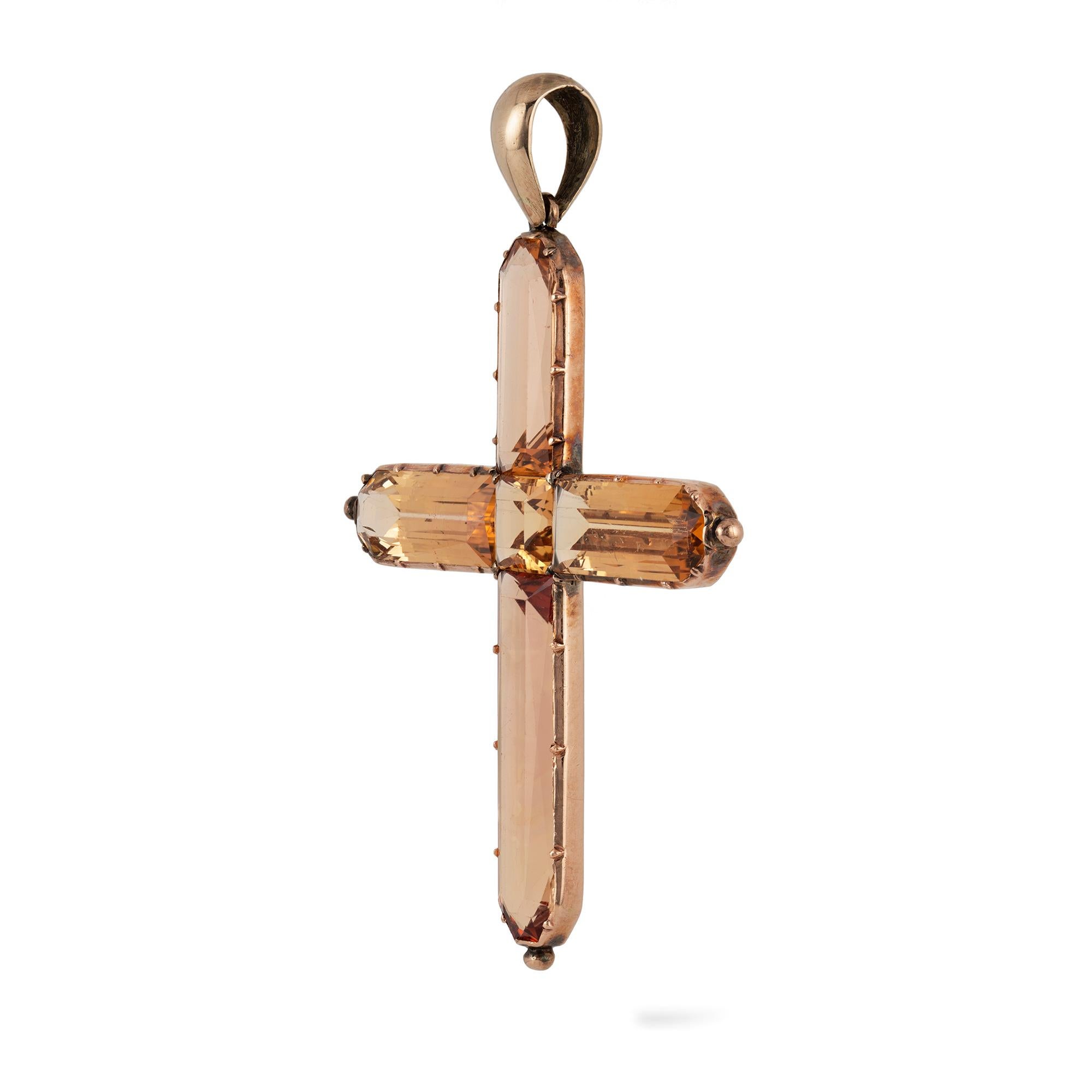 A Georgian topaz cross pendant, the centre and the arms of the Latin style cross set with sherry coloured faceted topazes, cut-down collet set to a gold mount and pendant loop, circa 1810, measuring approximately 6 x 4.2cm, gross weight 7.2