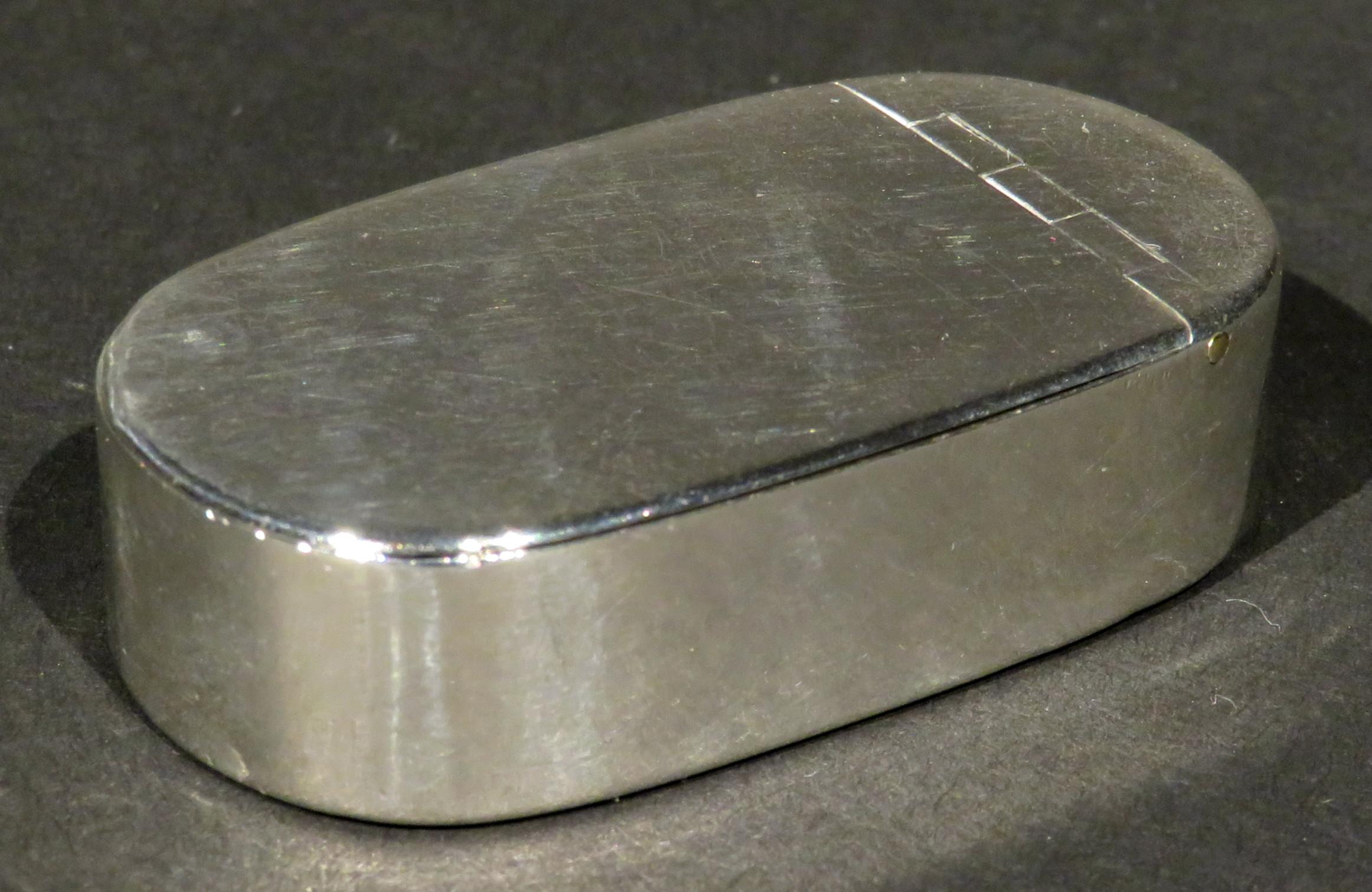 A very good early 19th century Georgian sterling silver pocket snuff box of oblong form, the top fitted with an exacting fine flush-mounted hinge, the reverse bearing impressed Birmingham hallmarks, date mark for 1802 and makers marks for Thomas