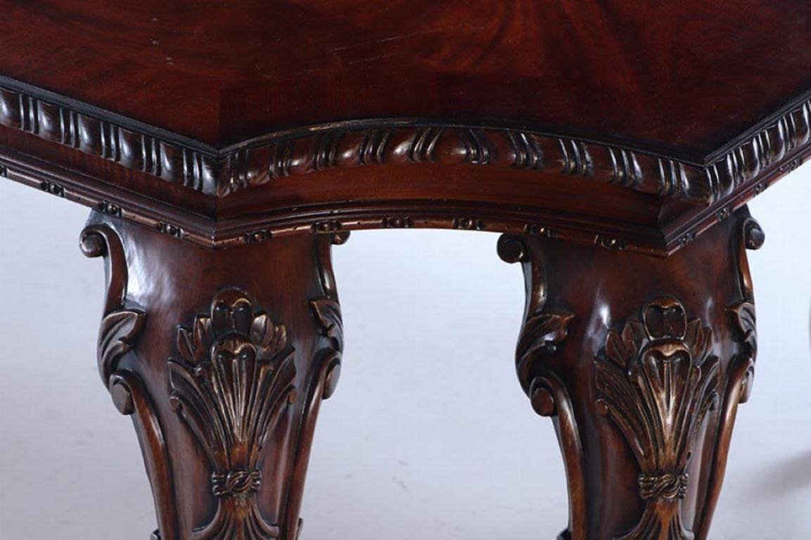 American A Georgian style carved mahogany dining table by Century.  For Sale