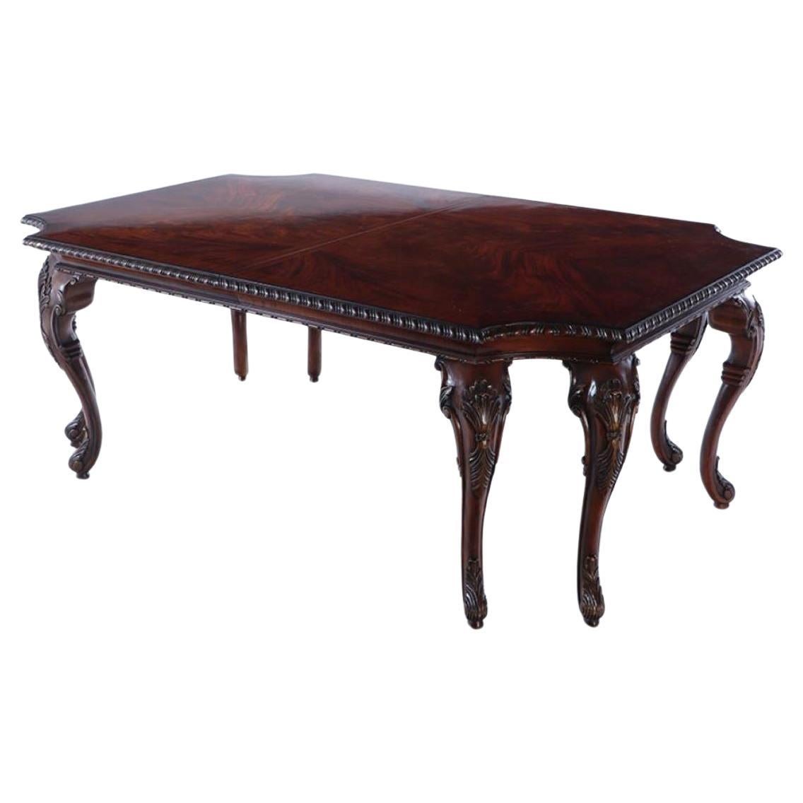 A Georgian style carved mahogany dining table by Century.  For Sale